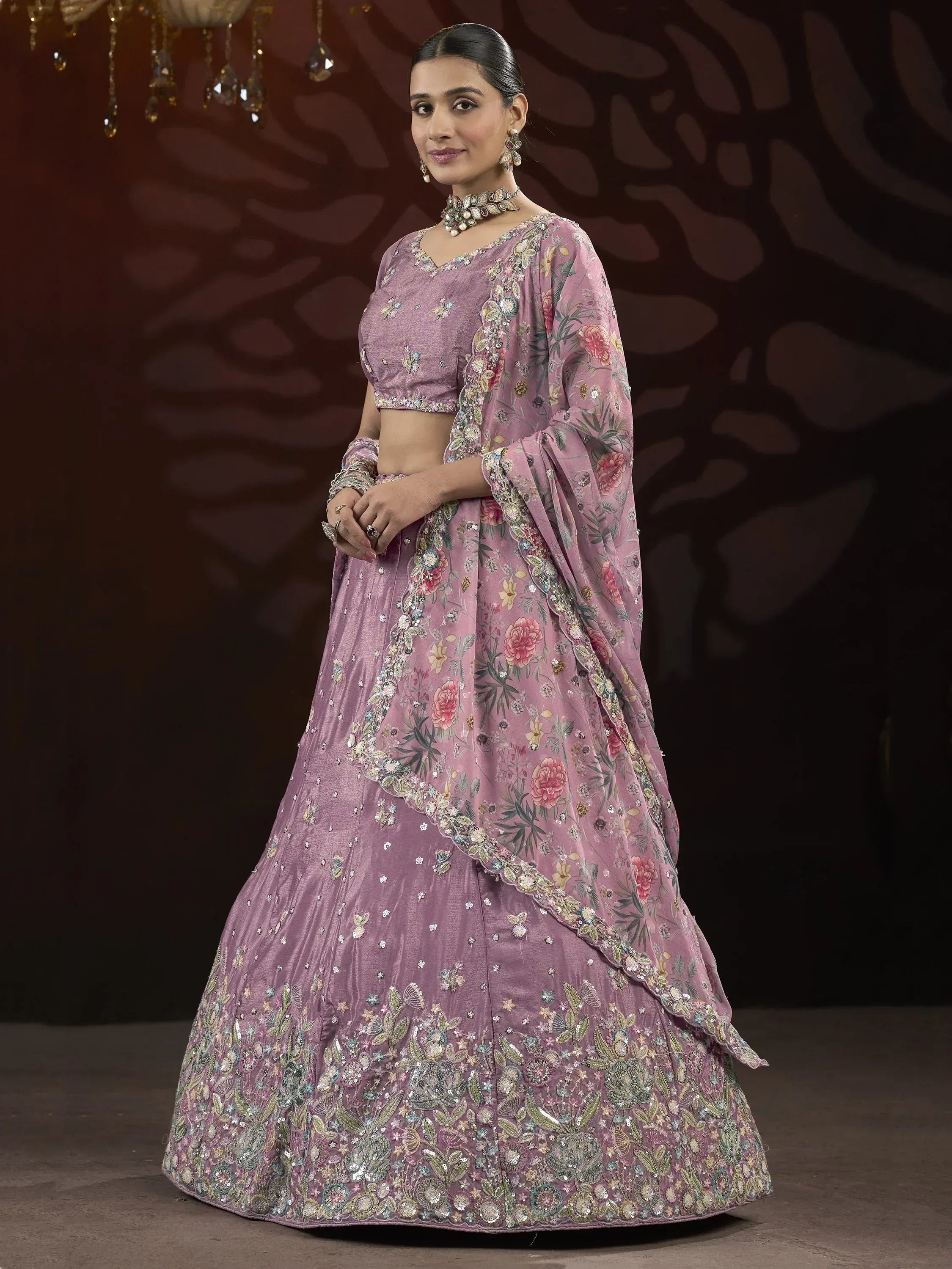 Elegant mauve lehenga choli with floral embroidery and sequins, perfect for Indian ethnic occasions.