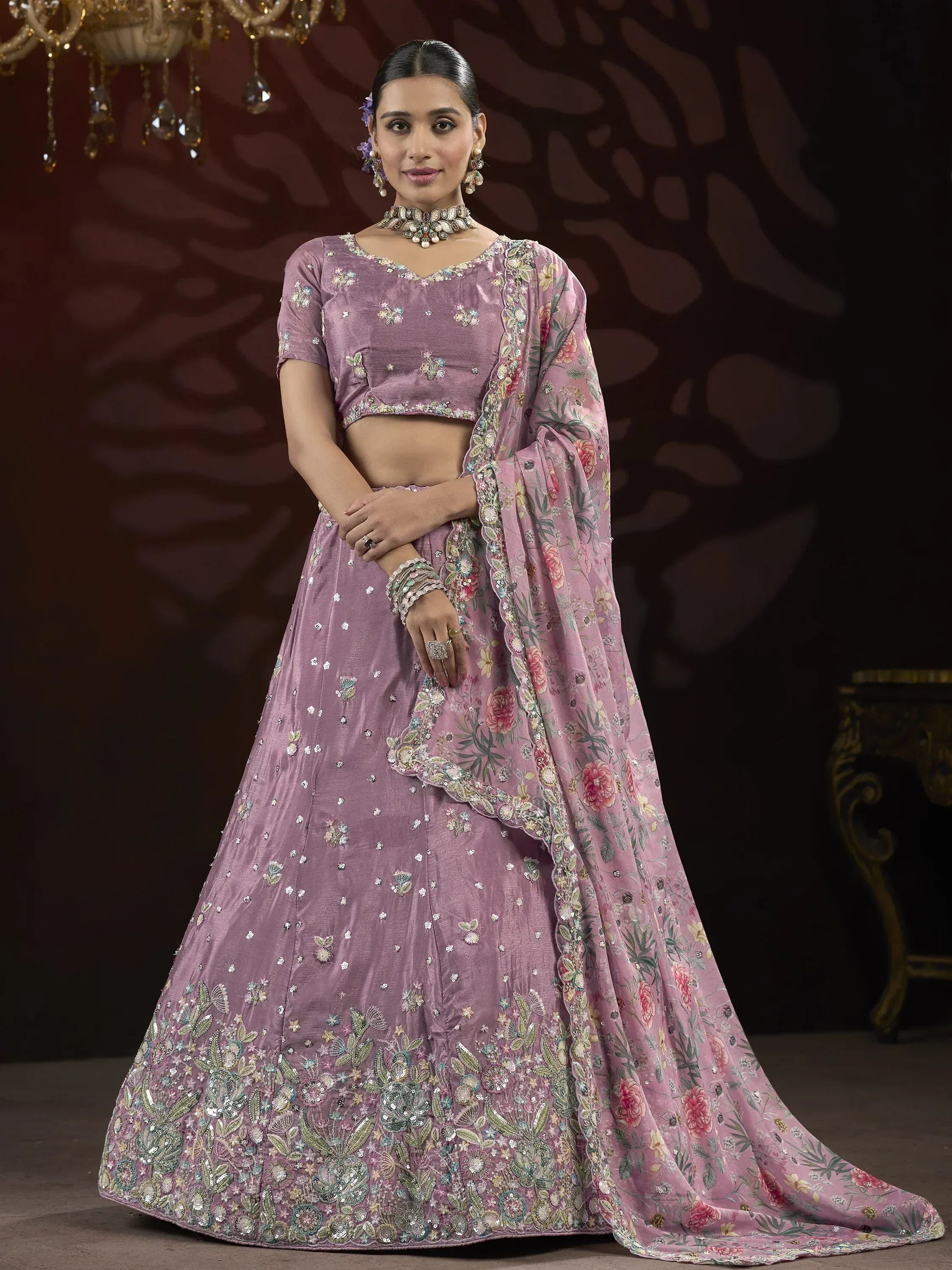 Elegant purple lehenga choli with floral embroidery and matching dupatta, perfect for Indian weddings and festive occasions.