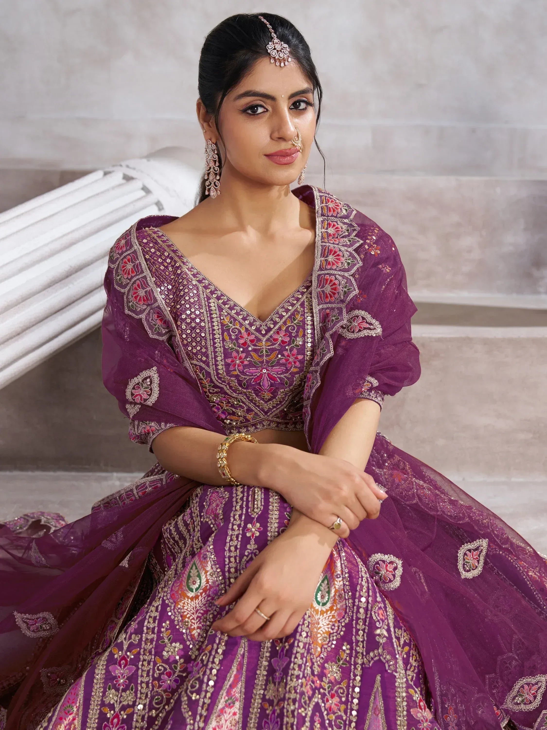Purple embroidered lehenga choli with floral motifs and sequin work, perfect for Indian ethnic occasions