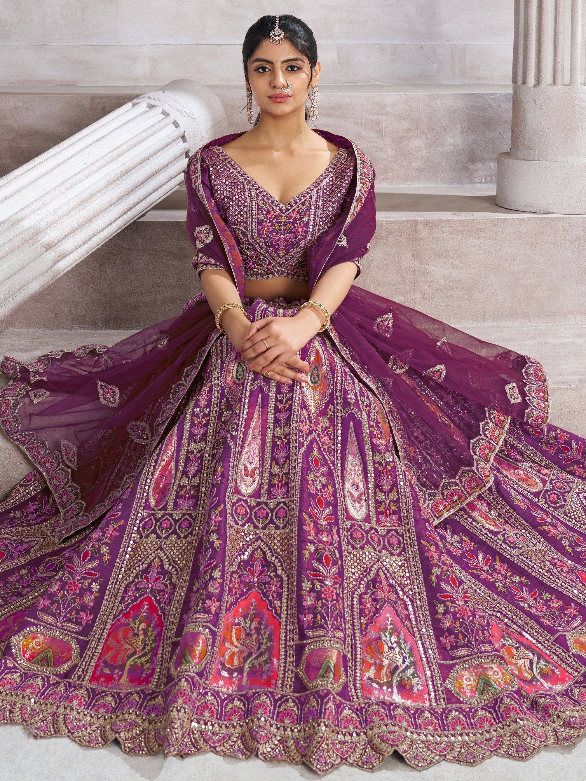 Purple embroidered lehenga choli with floral motifs, perfect for Indian weddings and festive occasions.