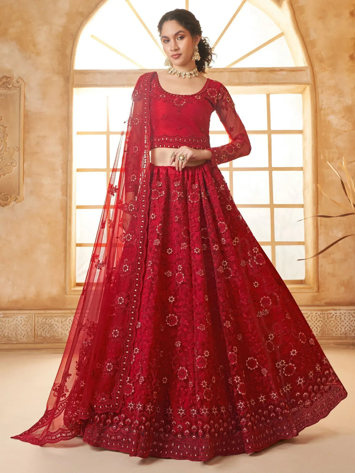Red embroidered lehenga choli with sheer dupatta, perfect for Indian weddings and festive occasions