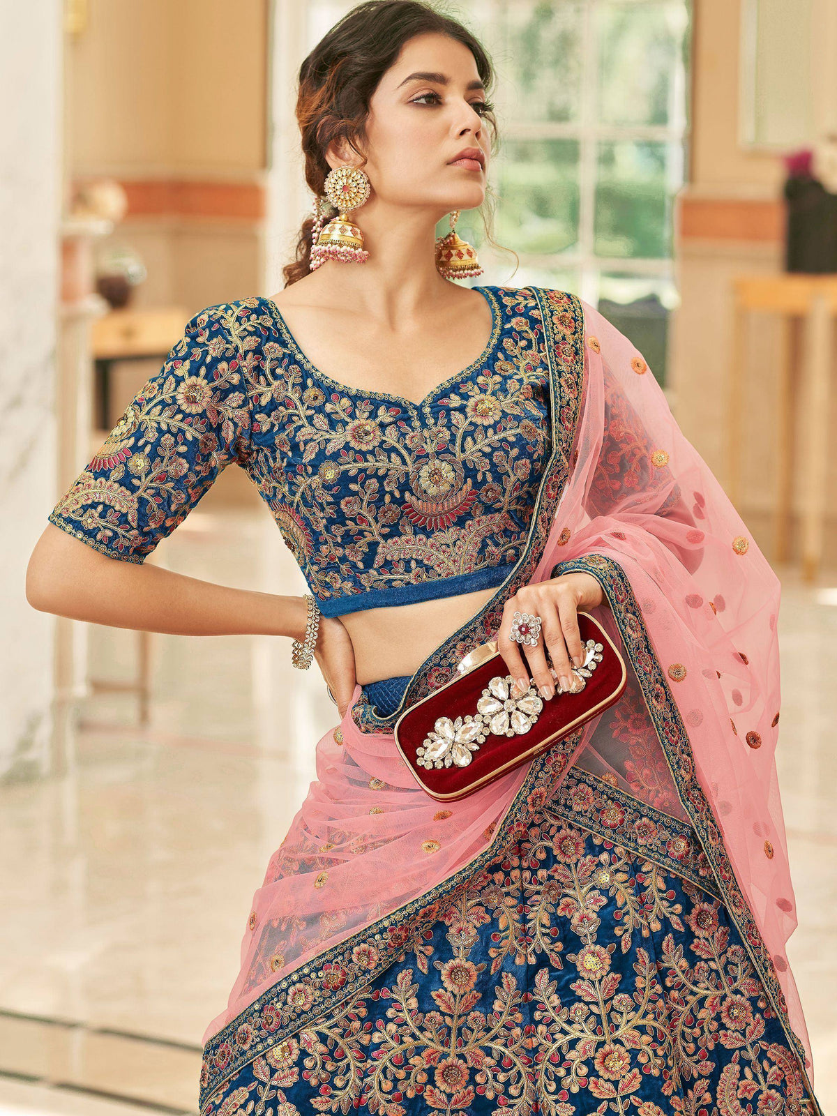 Blue embroidered lehenga choli with pink dupatta, perfect for Indian ethnic wear and festive occasions.