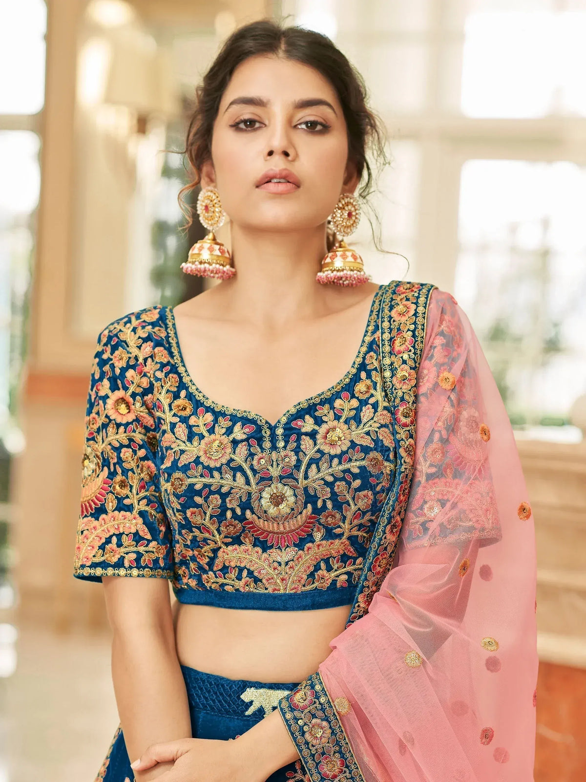 Blue embroidered lehenga choli with pink dupatta, floral gold detailing, perfect for Indian ethnic wear events