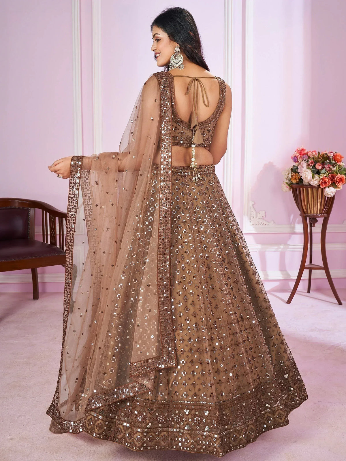 Elegant brown sequined lehenga choli with sheer dupatta, perfect for Indian ethnic wear