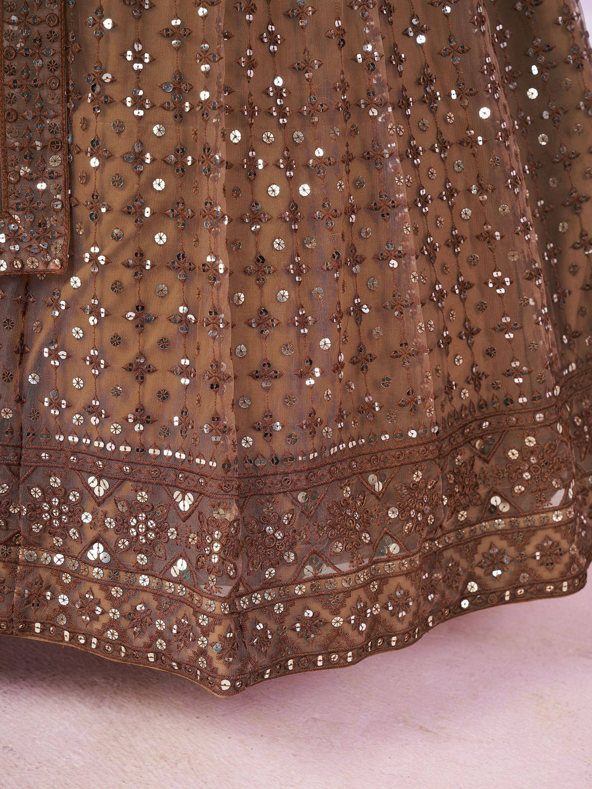Brown ethnic gown with intricate sequin and mirror work, perfect for Indian celebrations