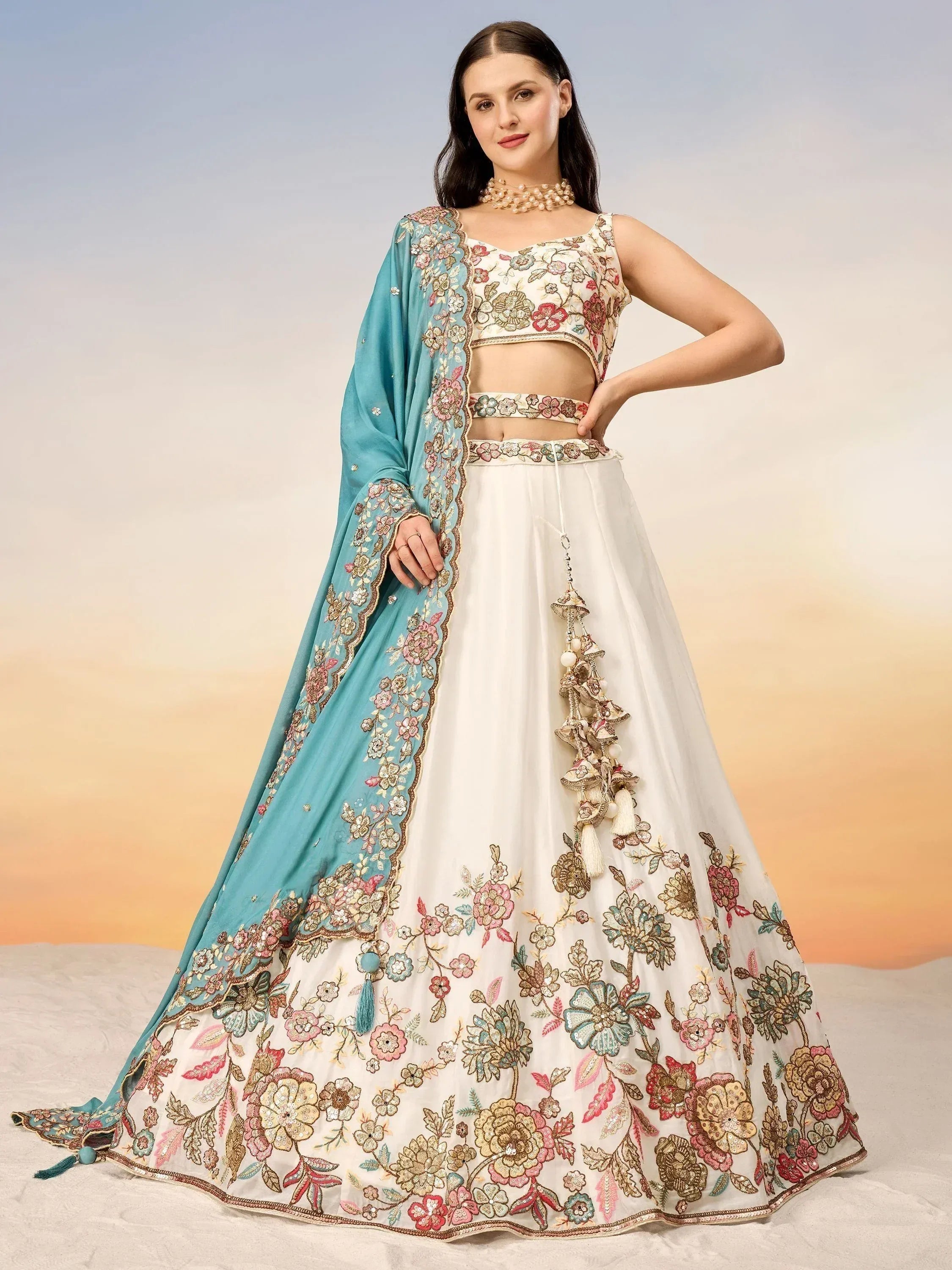 Floral embroidered white lehenga choli with turquoise dupatta, perfect for Indian ethnic wear occasions