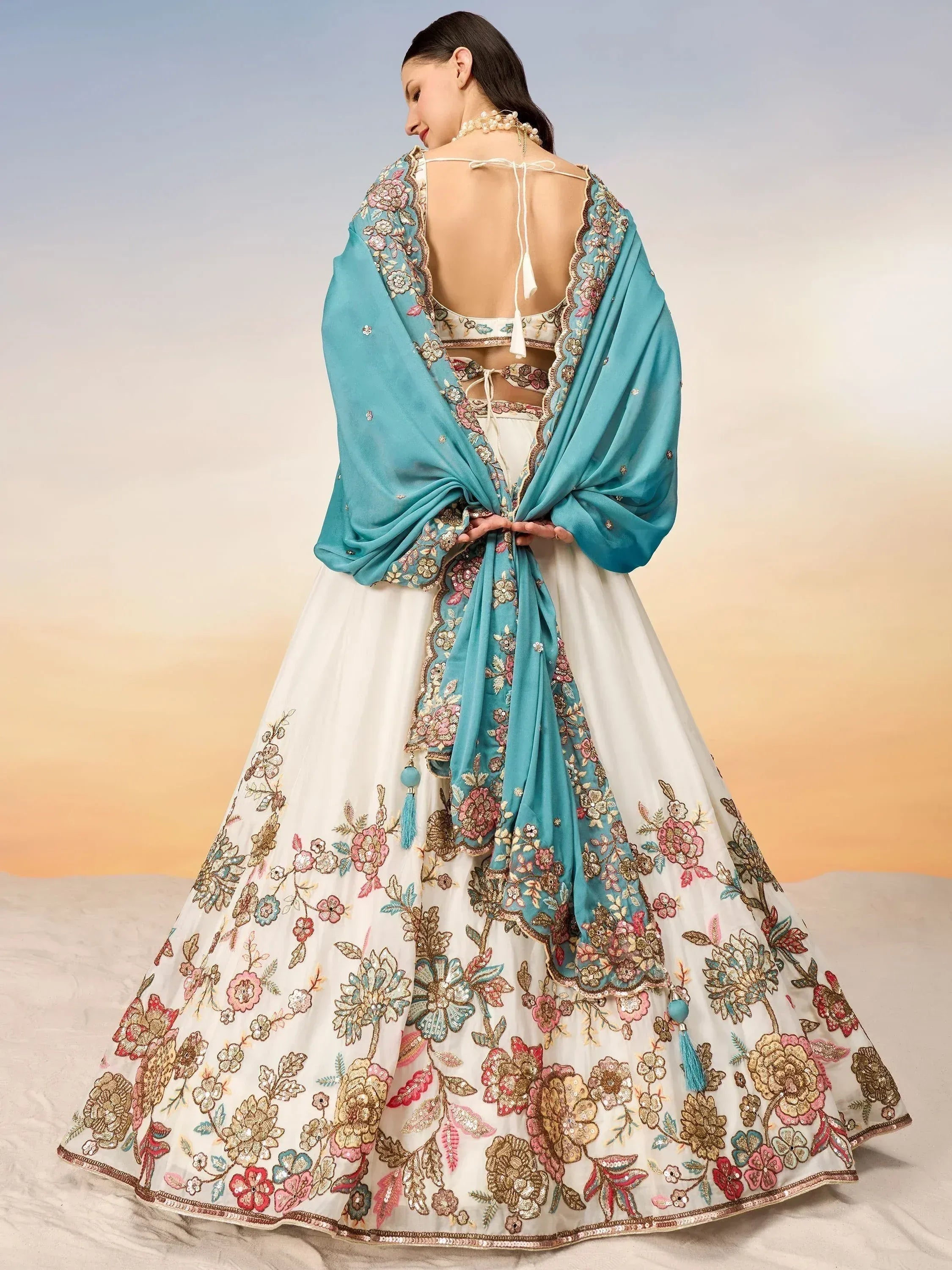 White floral embroidered lehenga choli with turquoise dupatta, back view, Indian ethnic wear