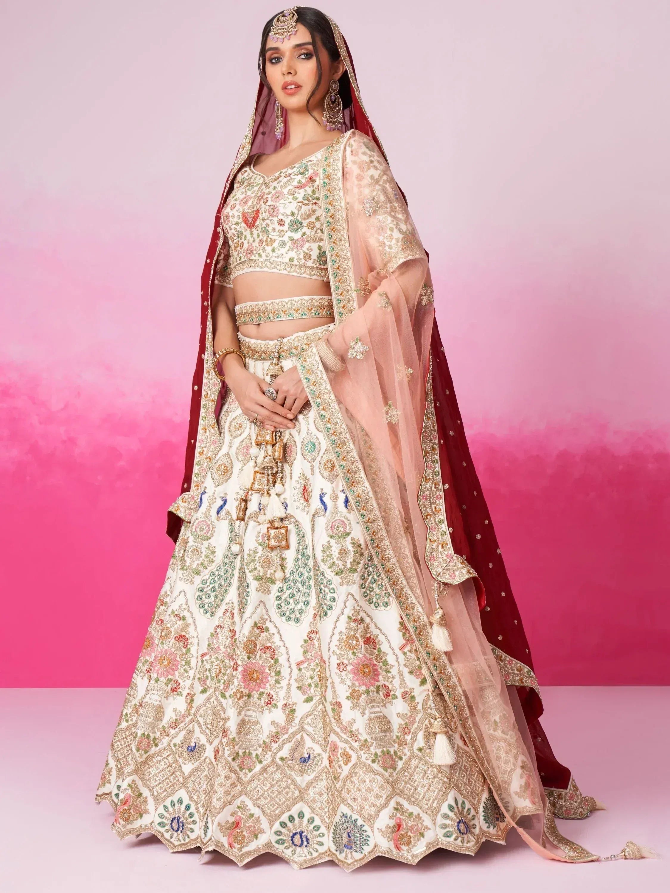 Designer lehenga choli with floral and peacock embroidery, paired with sheer dupatta for Indian ethnic wear