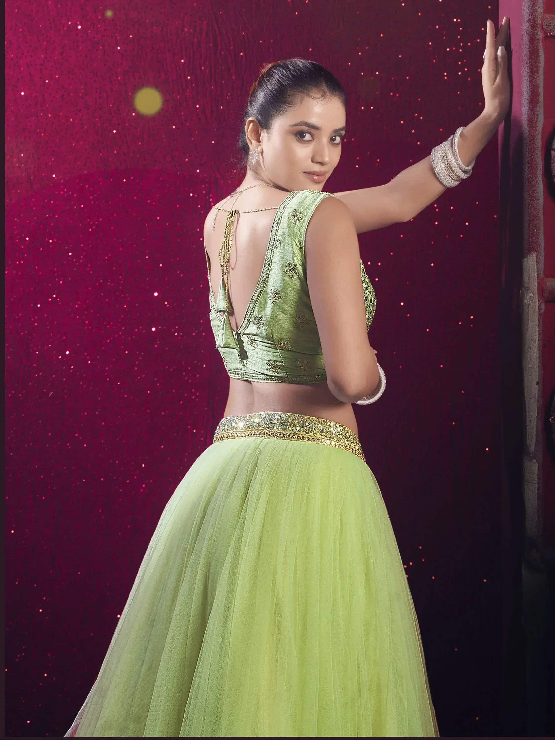 Green designer lehenga choli with gold embroidery, perfect for Indian ethnic wear events