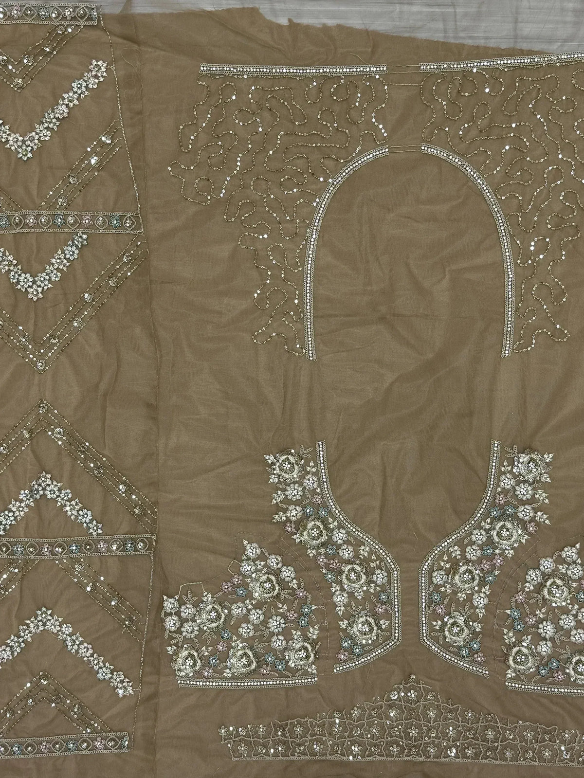 Brown ethnic wear fabric with intricate floral embroidery and sequin detailing for designer lehenga or saree