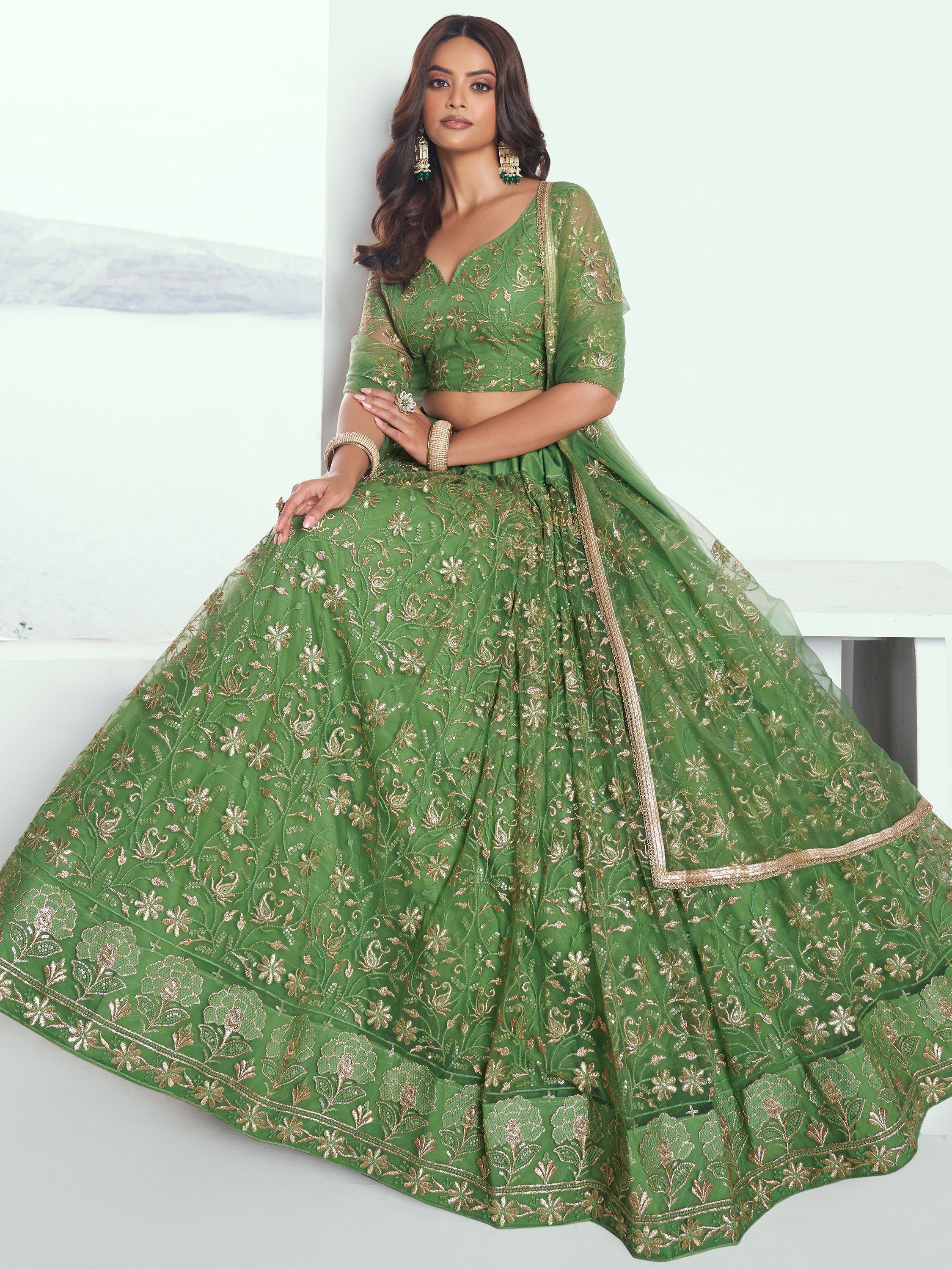 Green embroidered lehenga choli with gold floral detailing, perfect for Indian ethnic wear