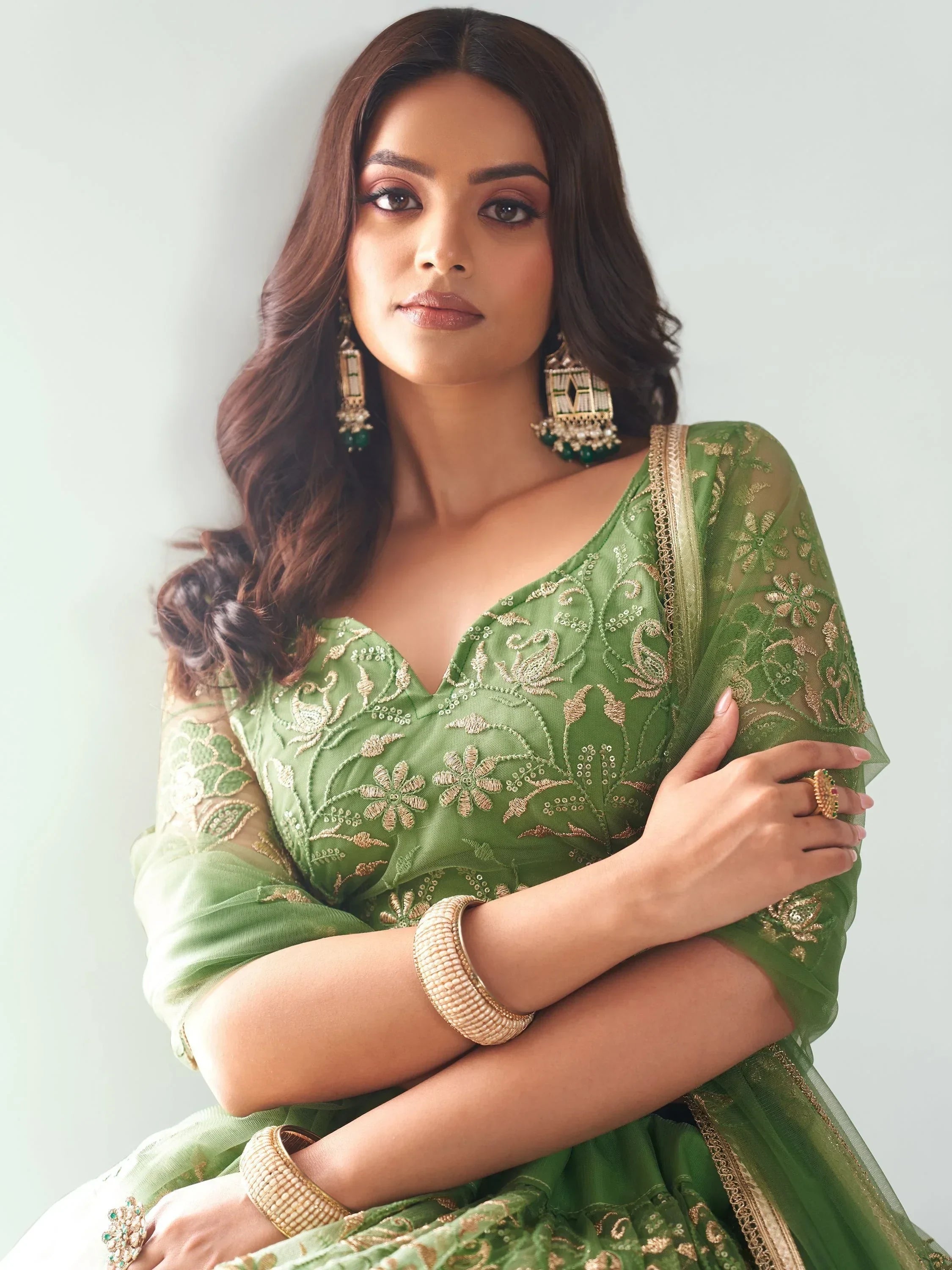 Green embroidered lehenga choli with gold detailing, perfect for Indian ethnic wear and festive occasions.