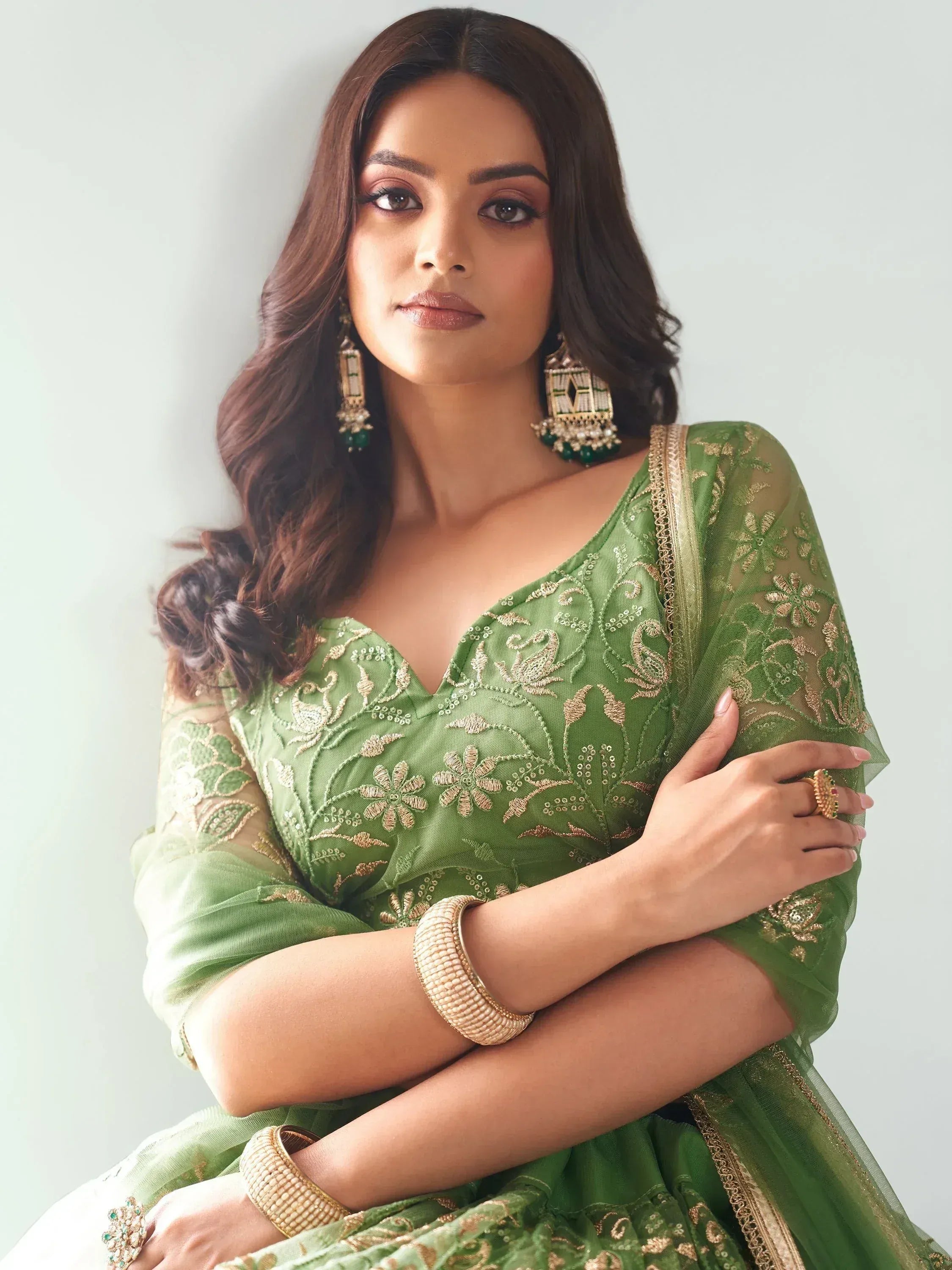 Green embroidered lehenga choli with gold detailing, perfect for Indian ethnic wear and festive occasions.