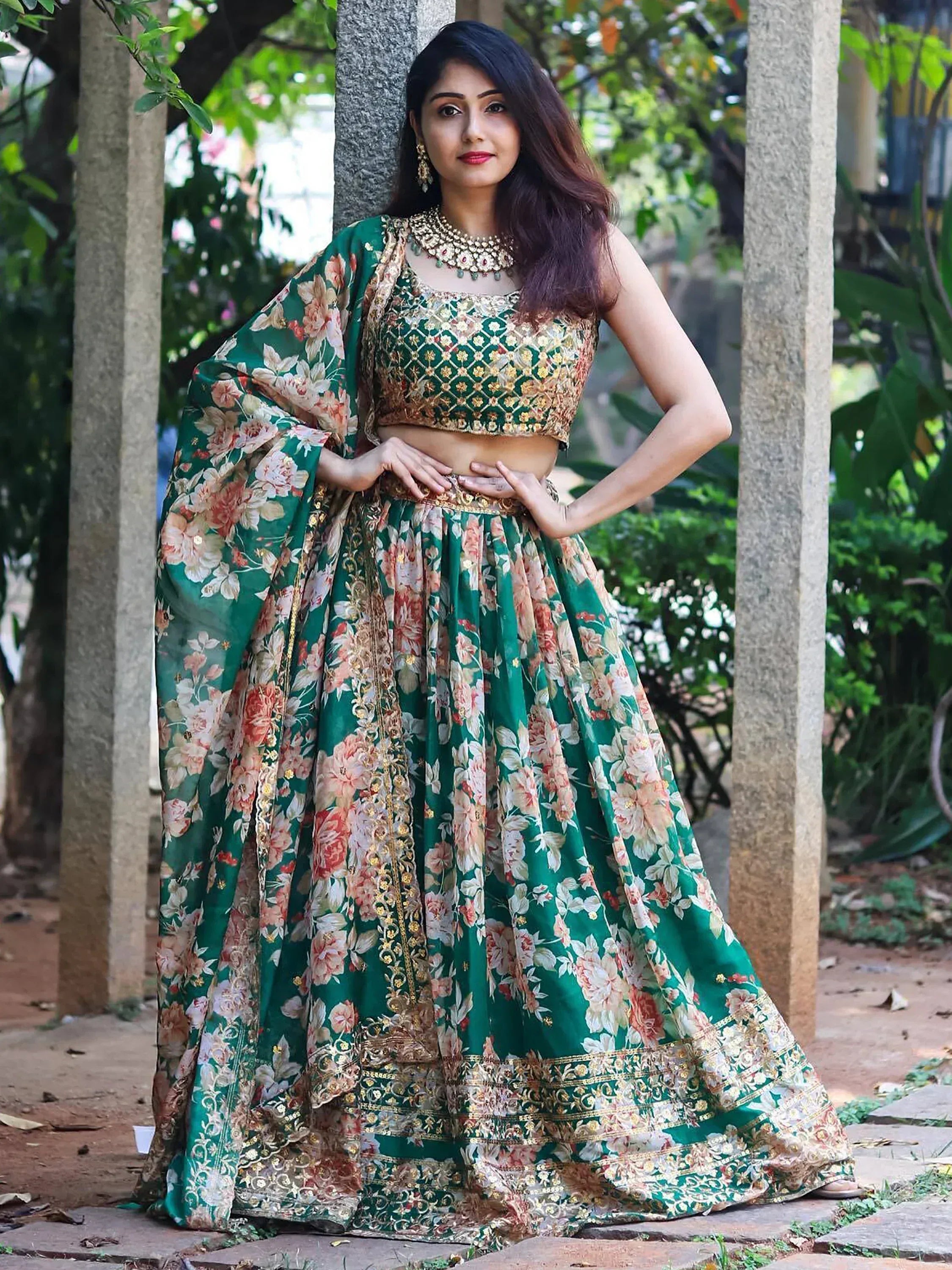 Green floral lehenga choli with gold embroidery, perfect for Indian ethnic wear and festive occasions.