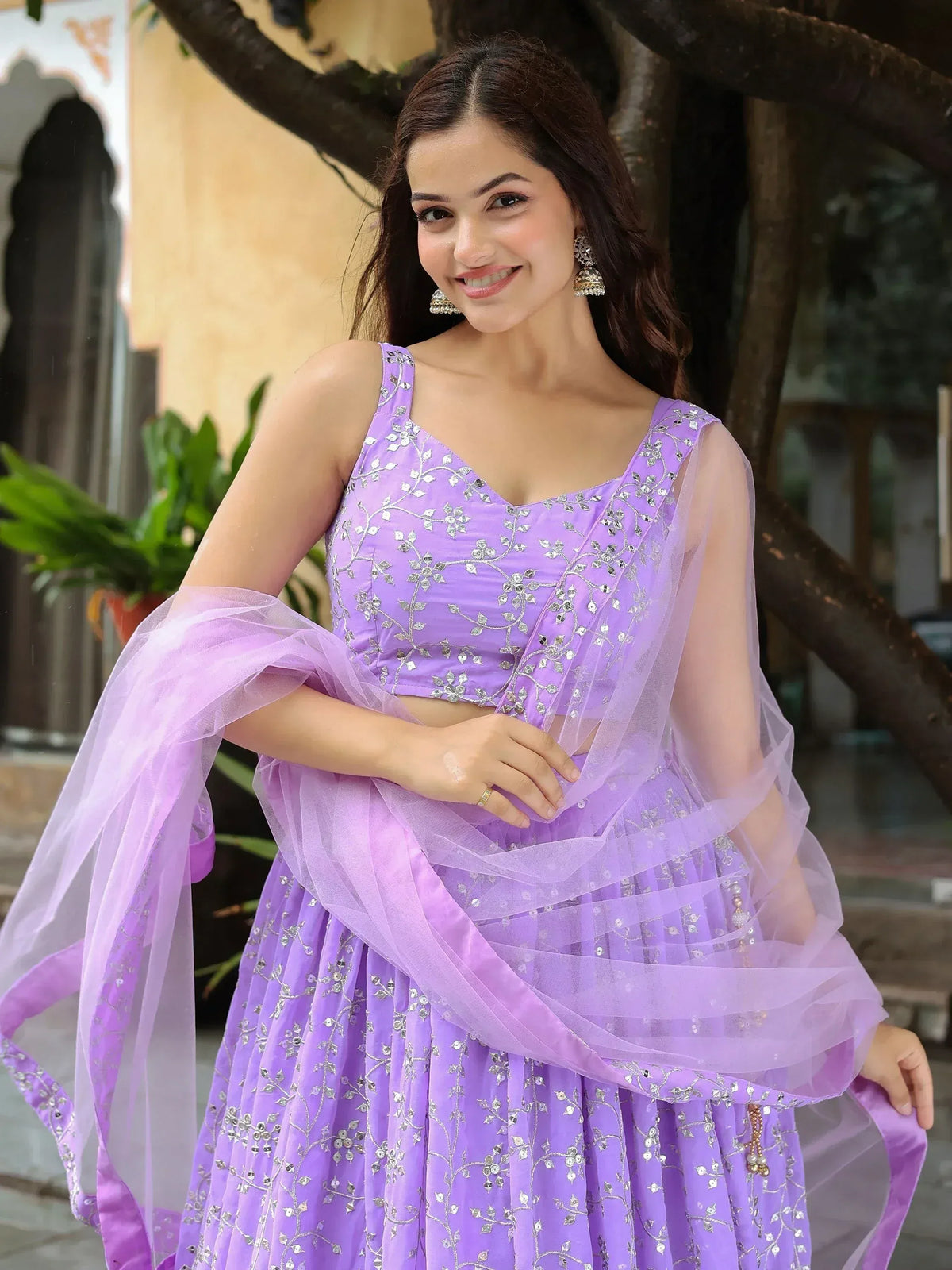 Lavender designer lehenga choli with silver embroidery and sheer dupatta, perfect for Indian ethnic occasions.