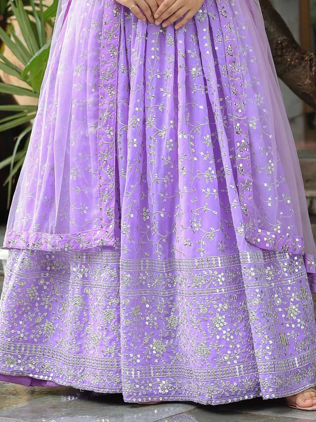 Lavender ethnic lehenga with silver floral embroidery and mirror work, perfect for Indian weddings and festive occasions.