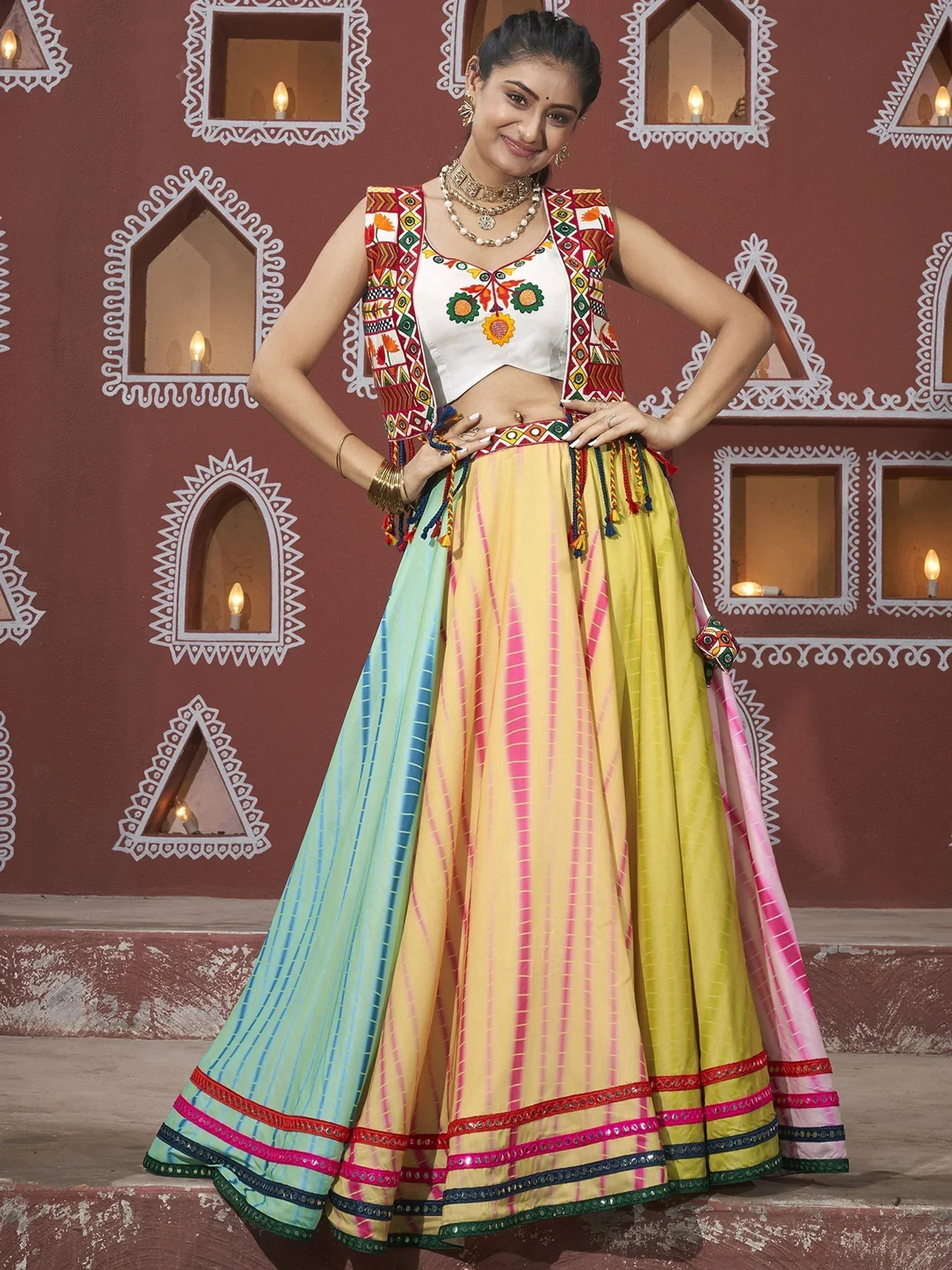 Colorful Indian lehenga choli with embroidered top and tie-dye skirt, perfect for ethnic occasions