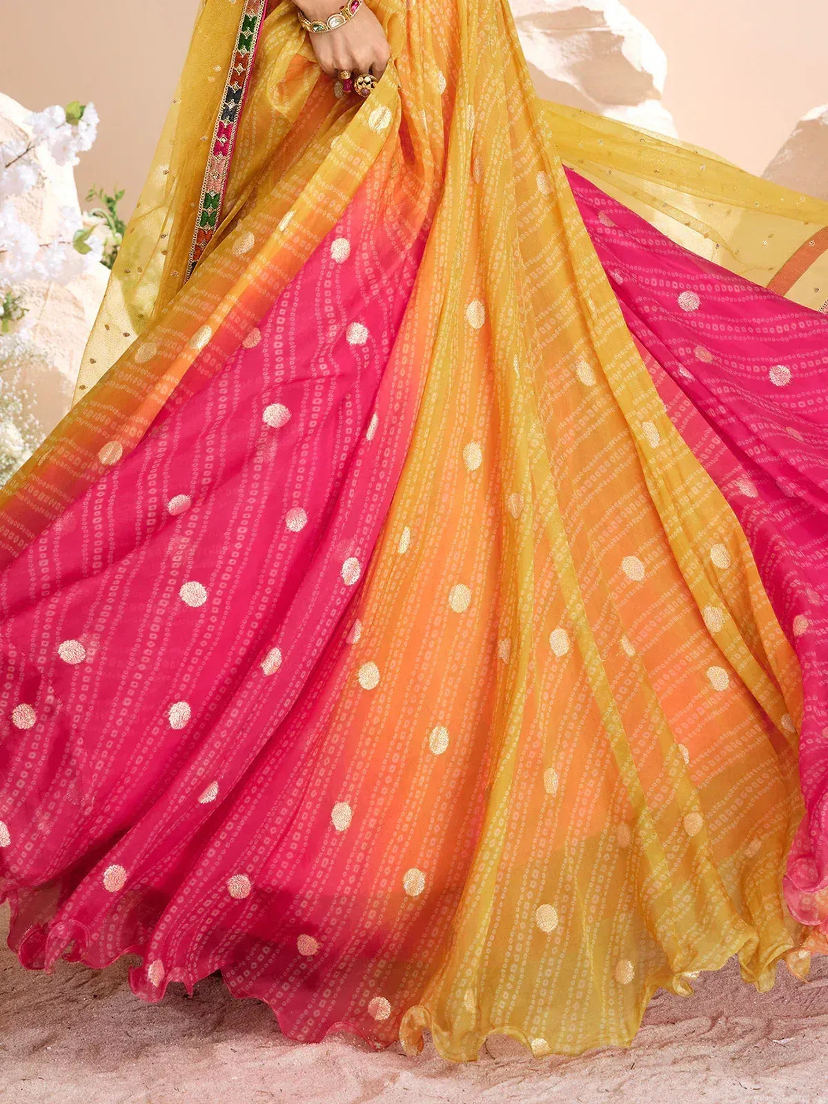 Vibrant yellow to pink ombre lehenga with gold dot print, perfect for Indian ethnic wear