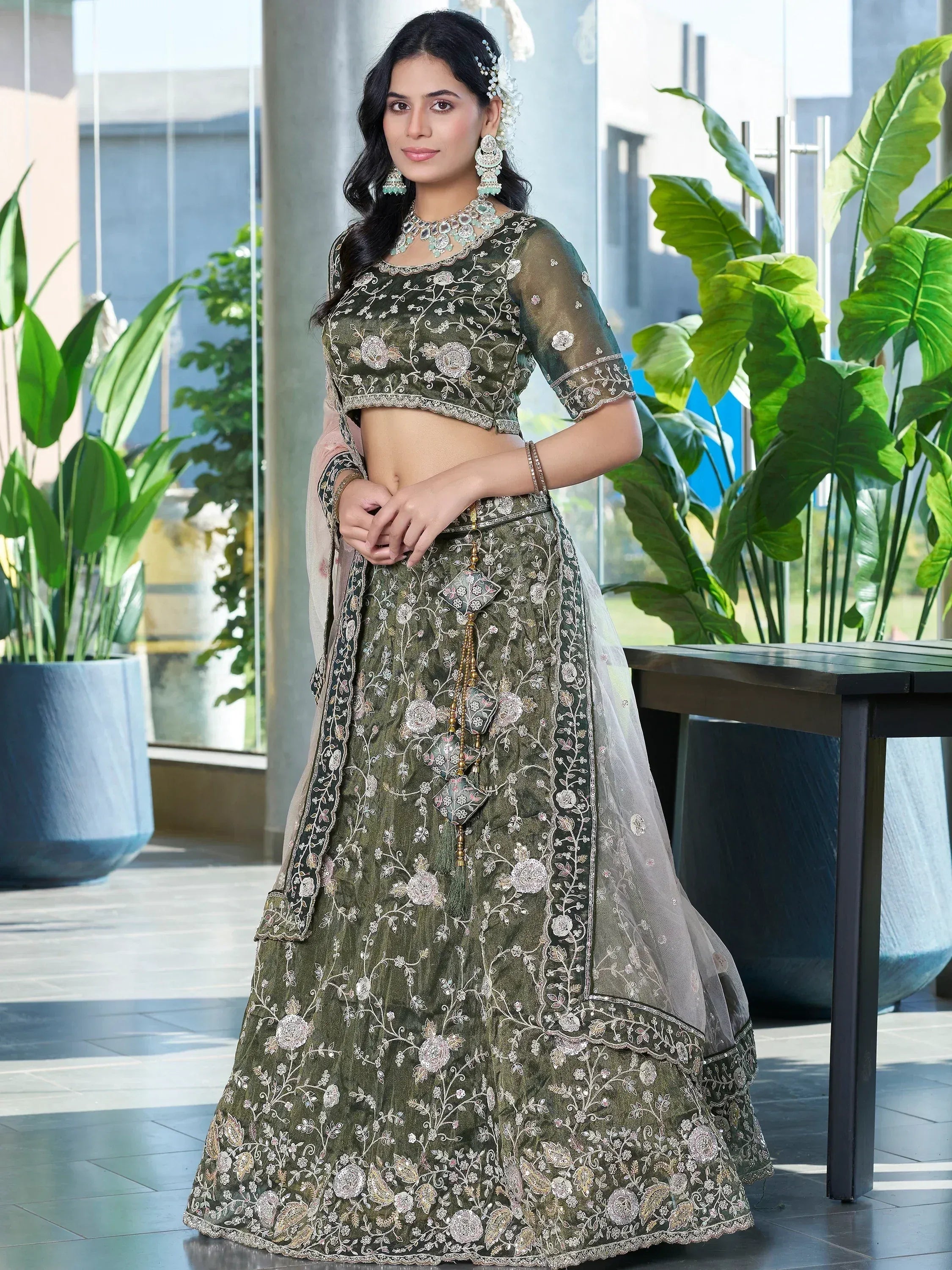 Elegant olive green embroidered lehenga choli with floral designs and sheer dupatta for Indian ethnic wear