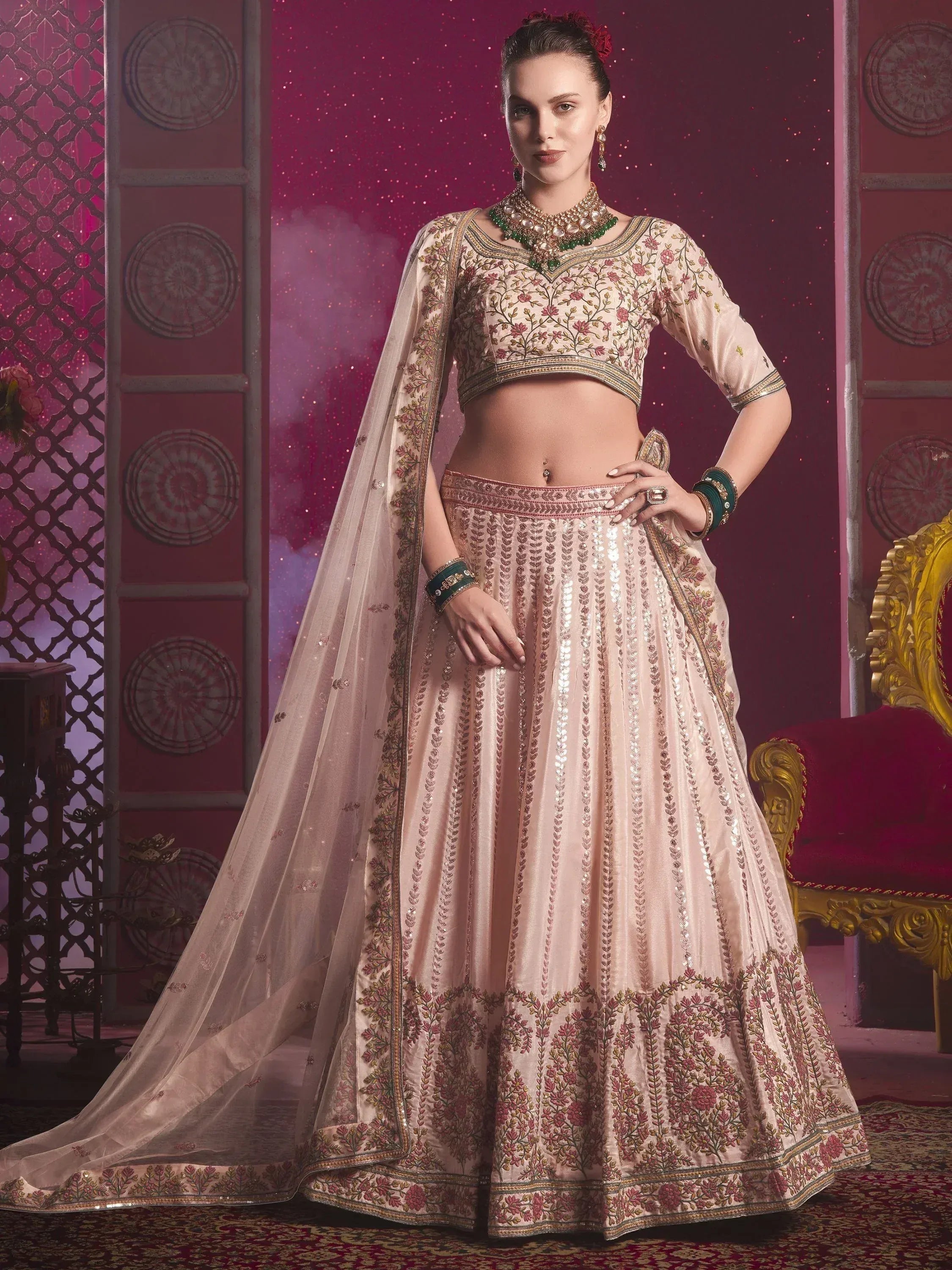 Elegant beige lehenga choli with floral embroidery and sequin detailing, perfect for Indian weddings and festive occasions.