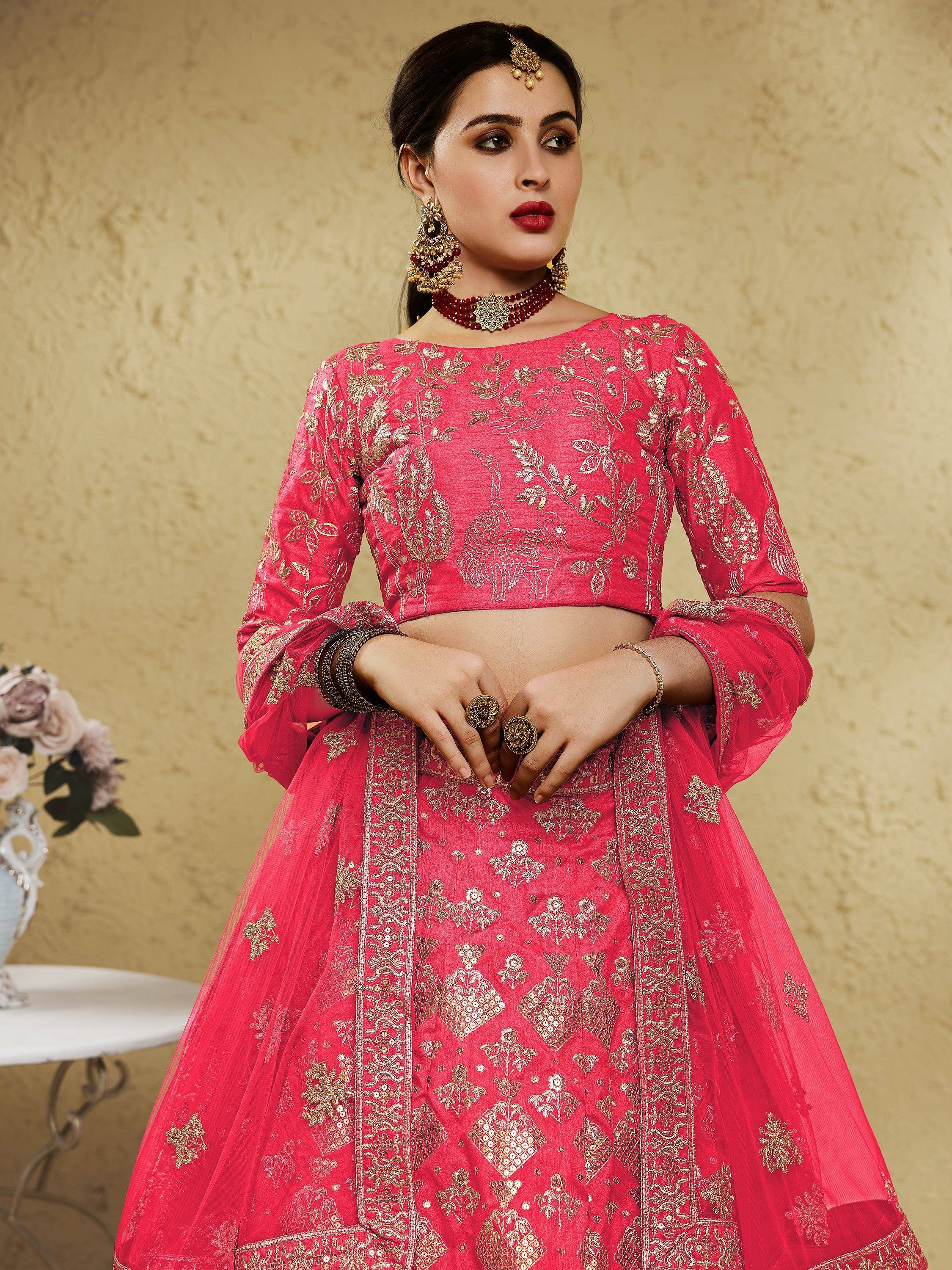 Pink embroidered lehenga choli with gold floral motifs, perfect for Indian weddings and festive occasions