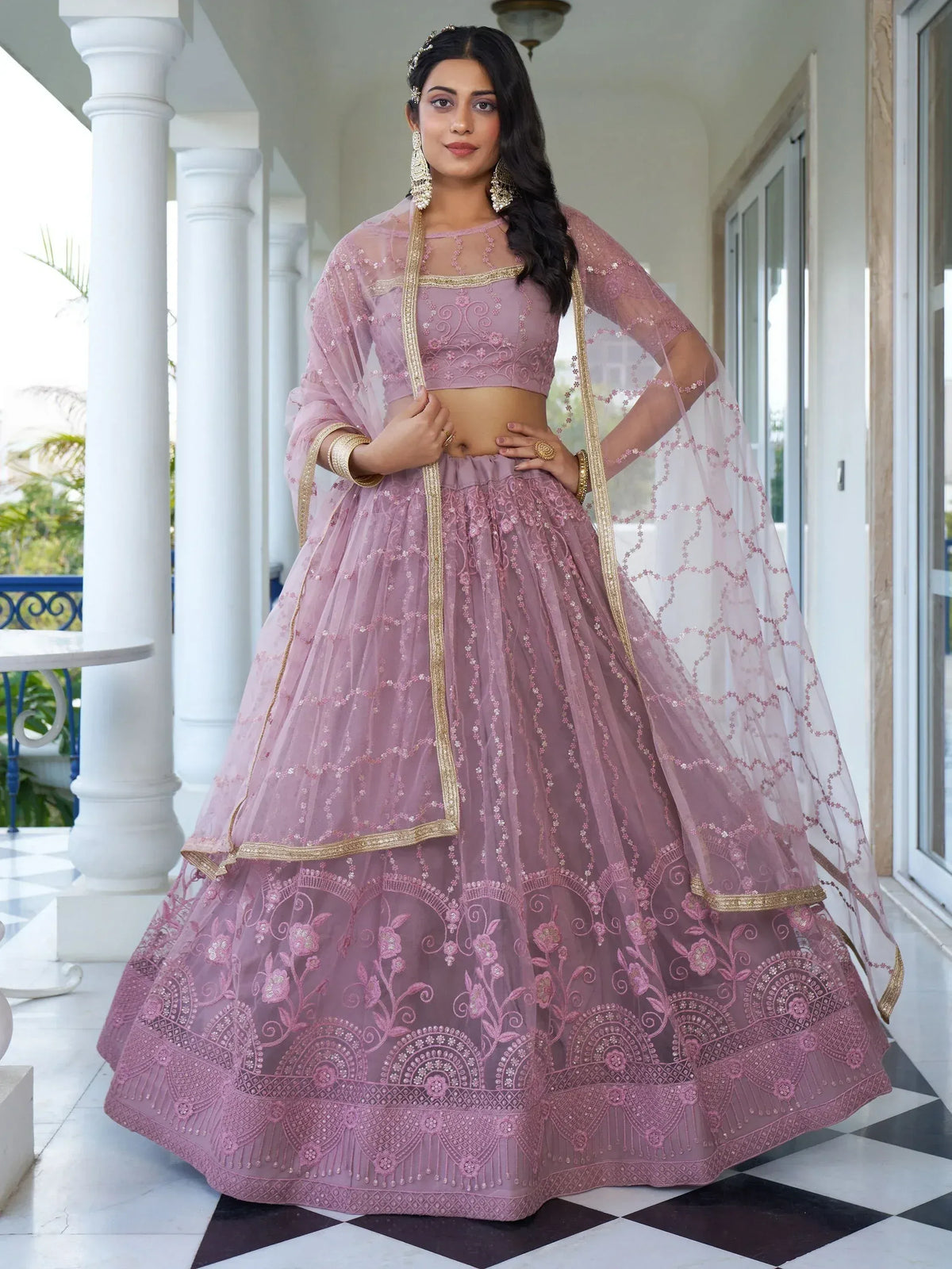 Pink embroidered lehenga choli with gold trim, perfect for Indian weddings and festive occasions