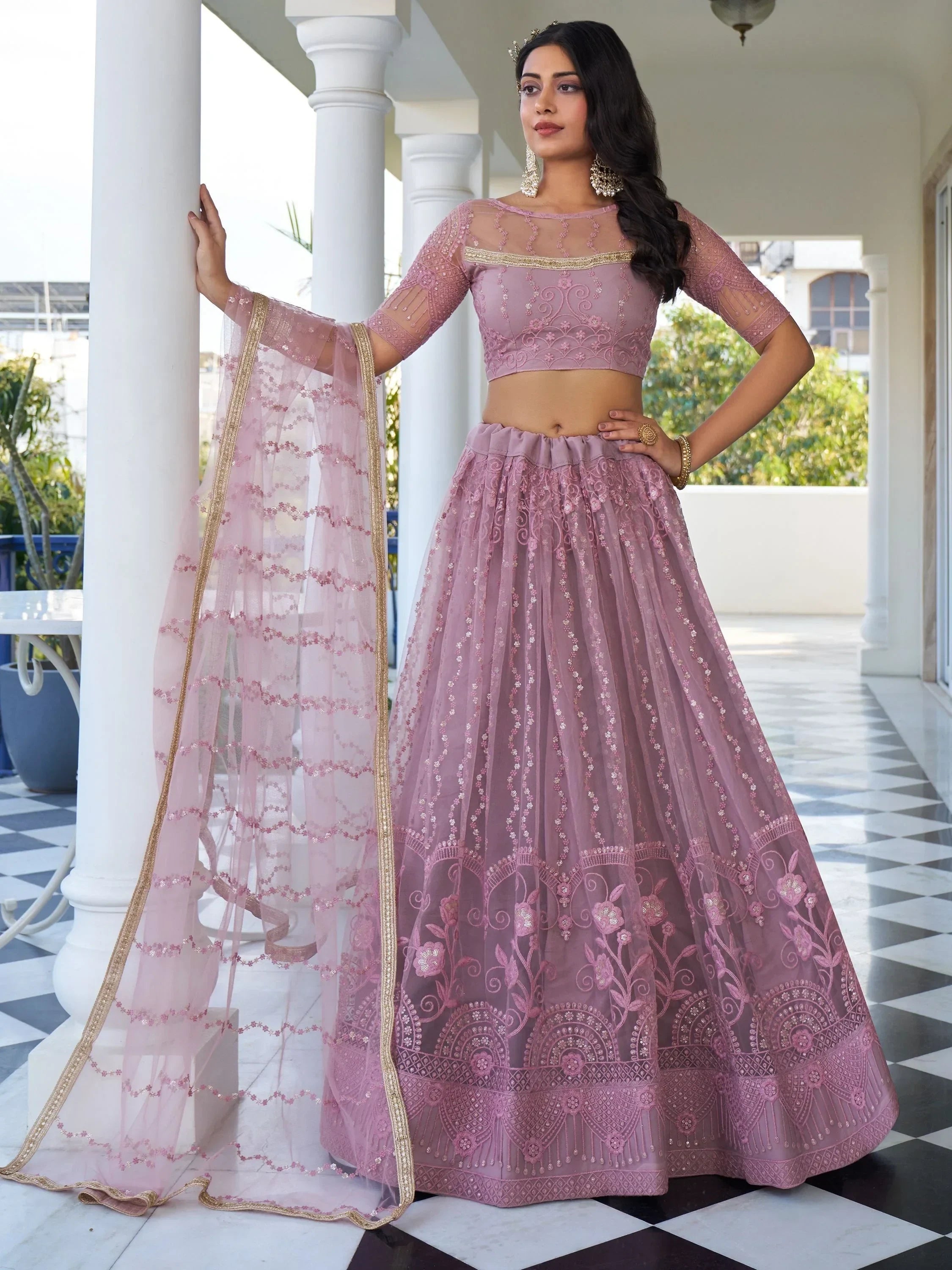 Pink embroidered lehenga choli with sheer dupatta, perfect for Indian ethnic wear and festive occasions.