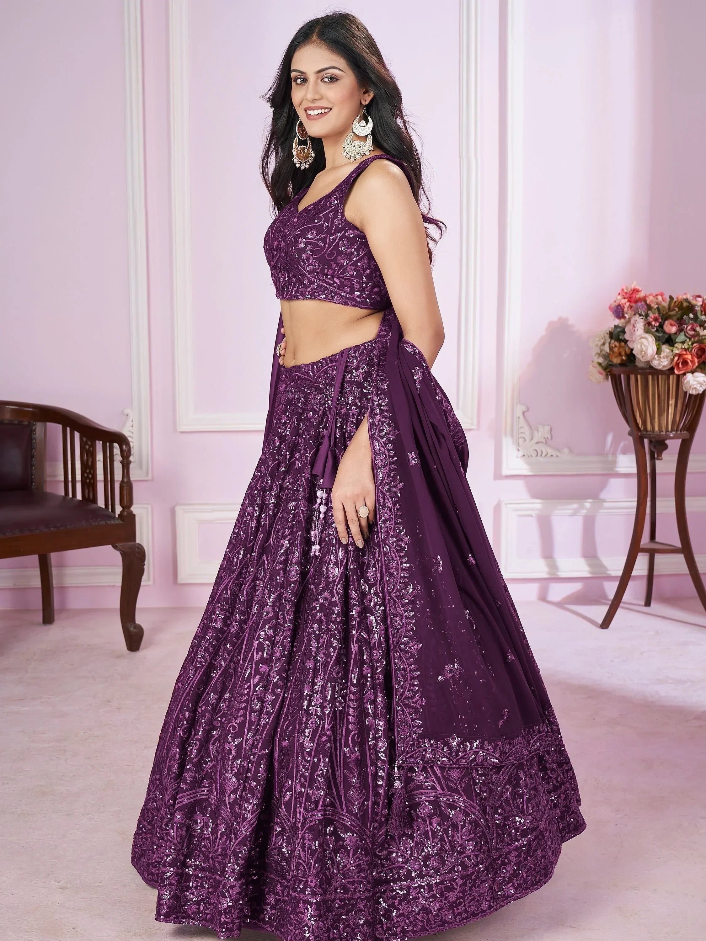 Purple designer lehenga choli with intricate embroidery and sequins, perfect for Indian ethnic occasions