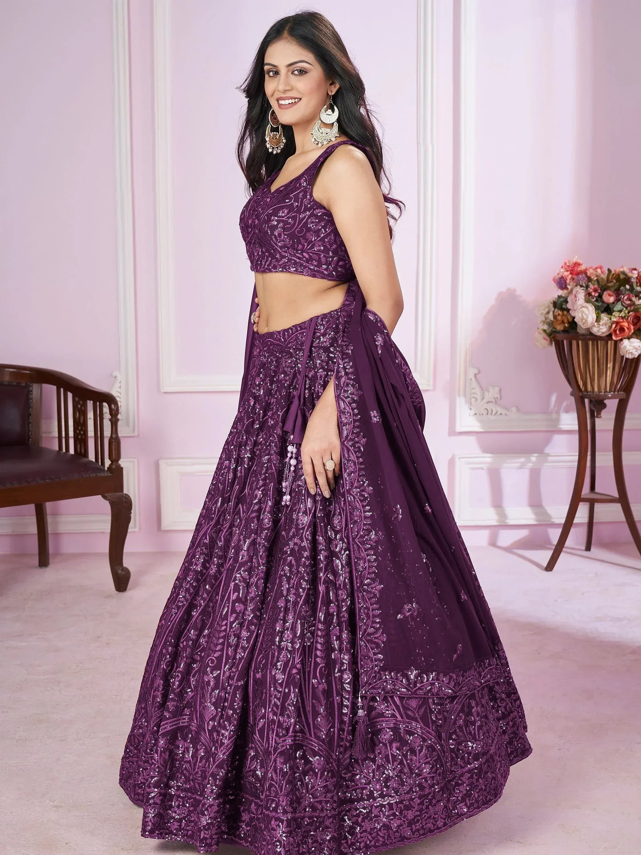 Purple designer lehenga choli with intricate embroidery and sequins, perfect for Indian ethnic occasions