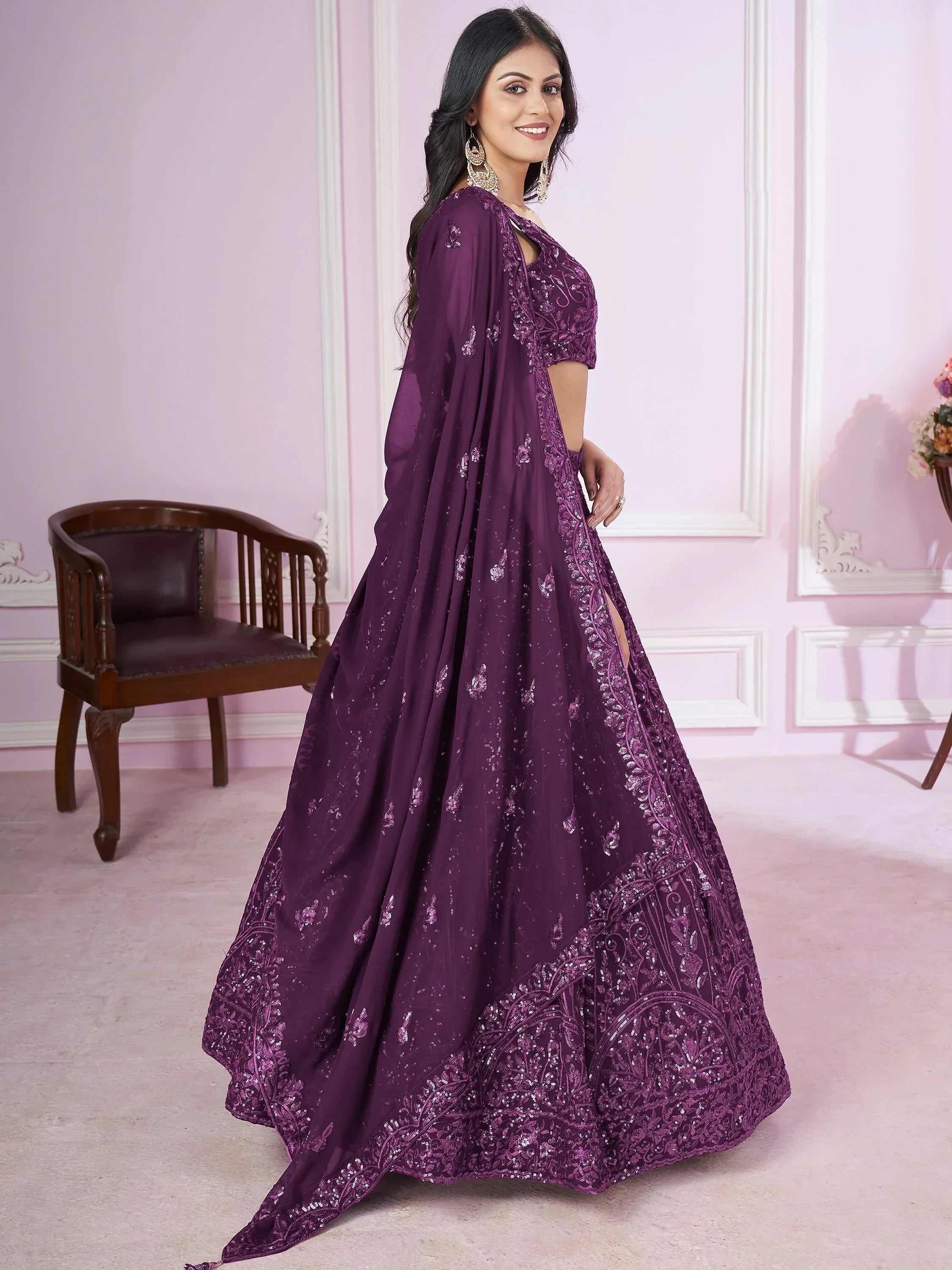Purple designer lehenga choli with intricate embroidery and sequin work, perfect for Indian ethnic occasions.