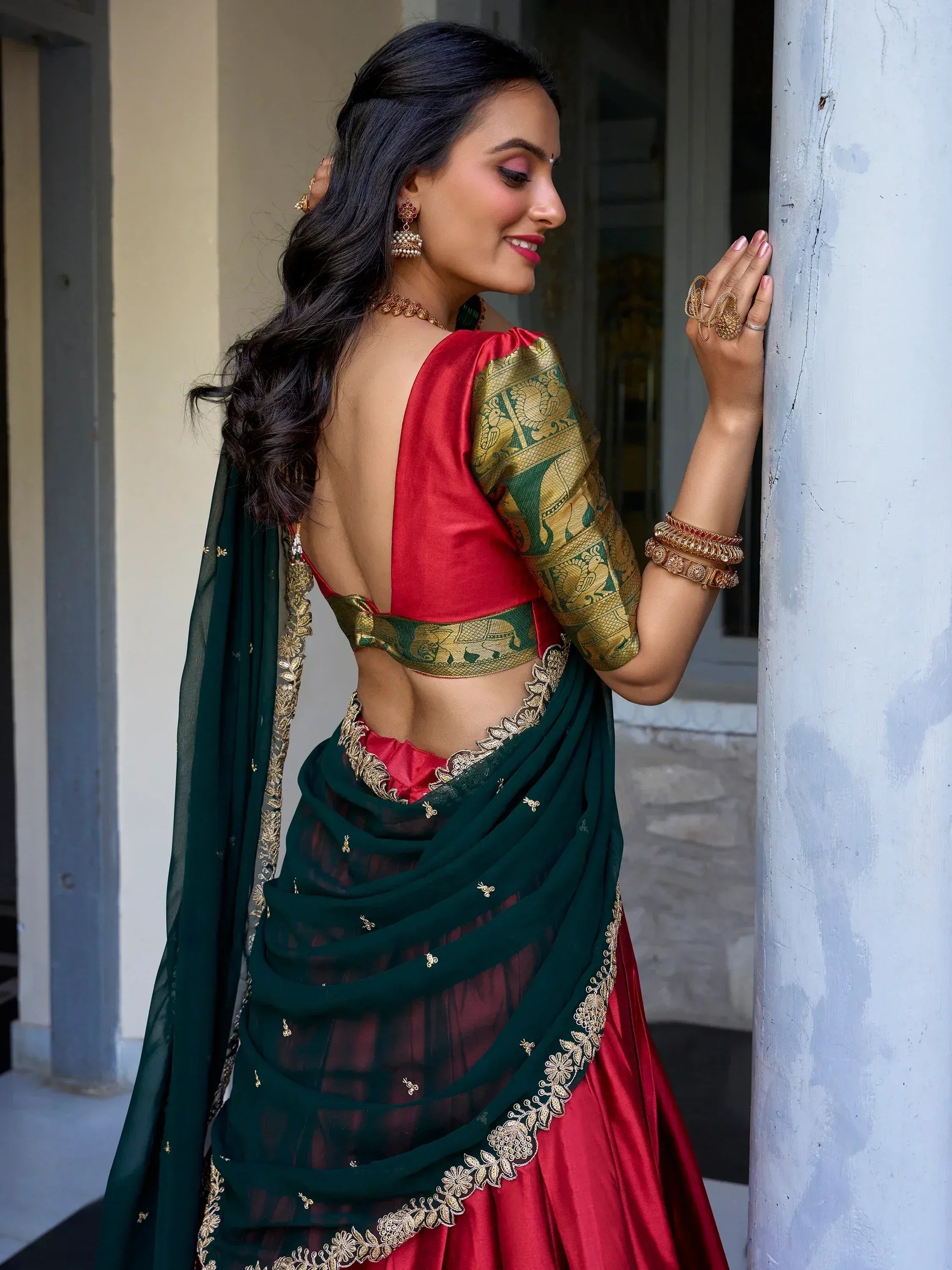 Elegant red and green saree with gold embroidery, backless blouse, traditional Indian ethnic wear