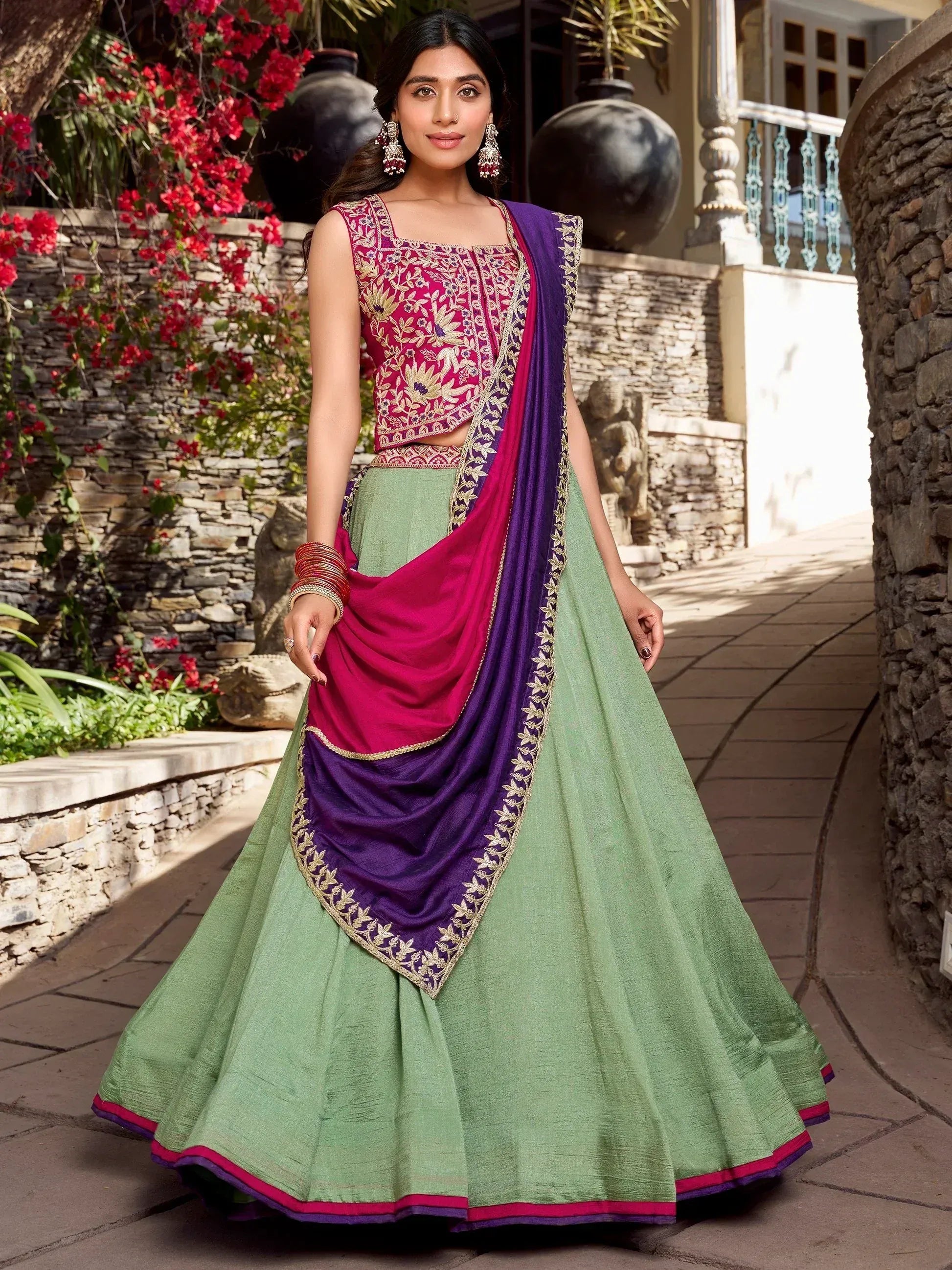 Green lehenga choli with pink and purple dupatta, floral embroidery, ethnic Indian wear