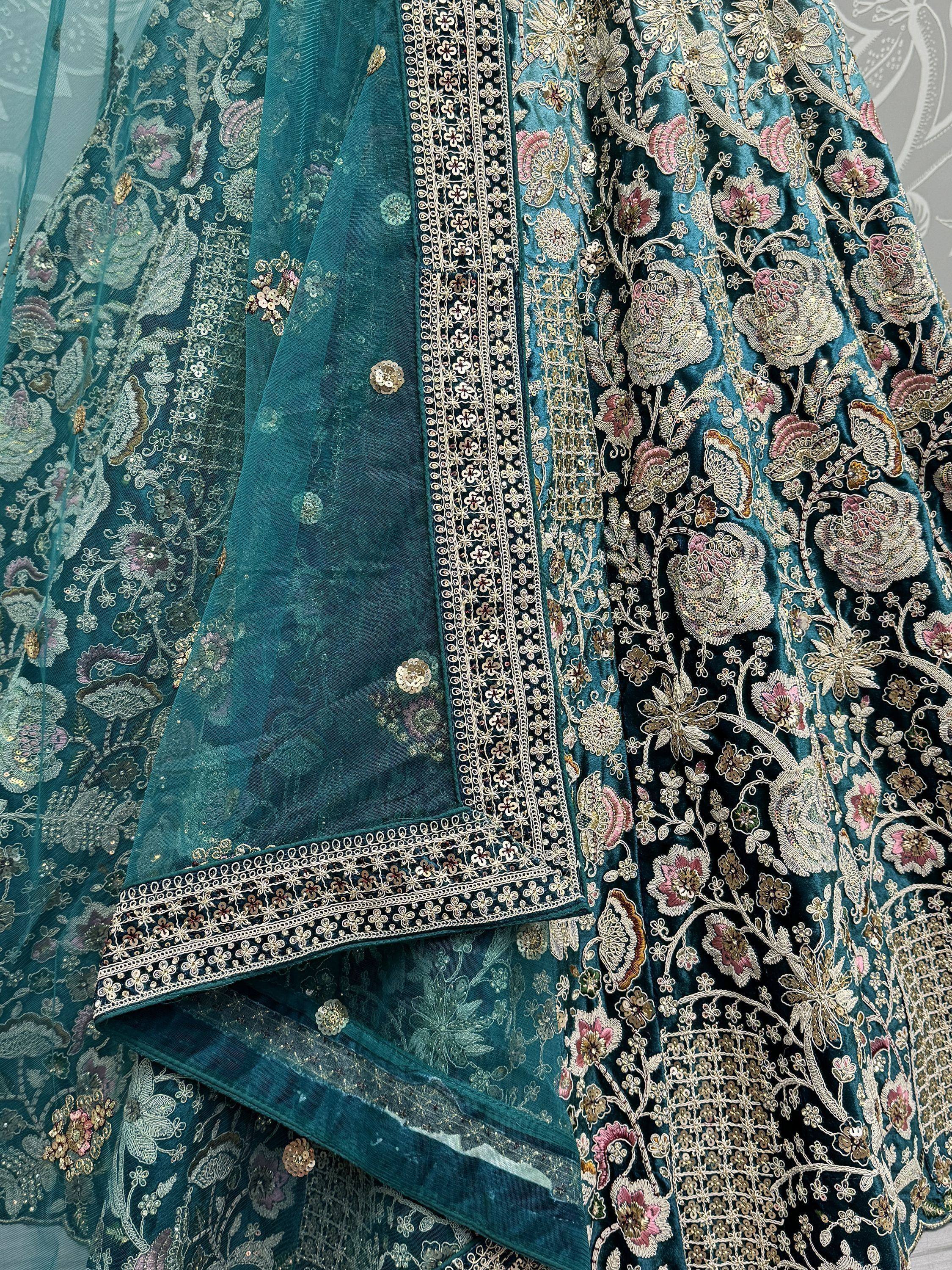 Teal velvet lehenga choli with floral embroidery and sequin work, perfect for Indian ethnic wear