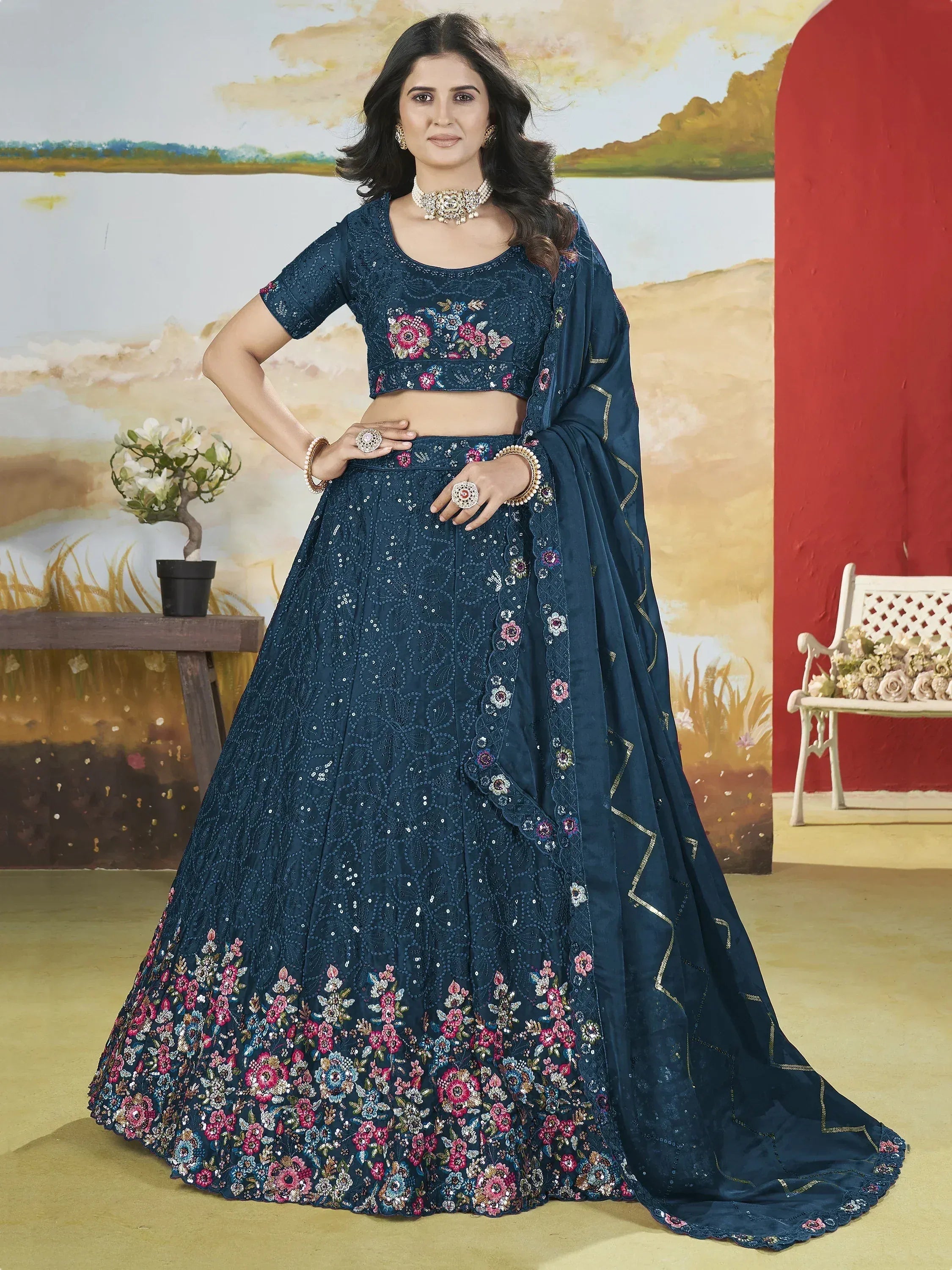 Navy blue embroidered lehenga choli with floral motifs and sequin work, perfect for Indian ethnic occasions.