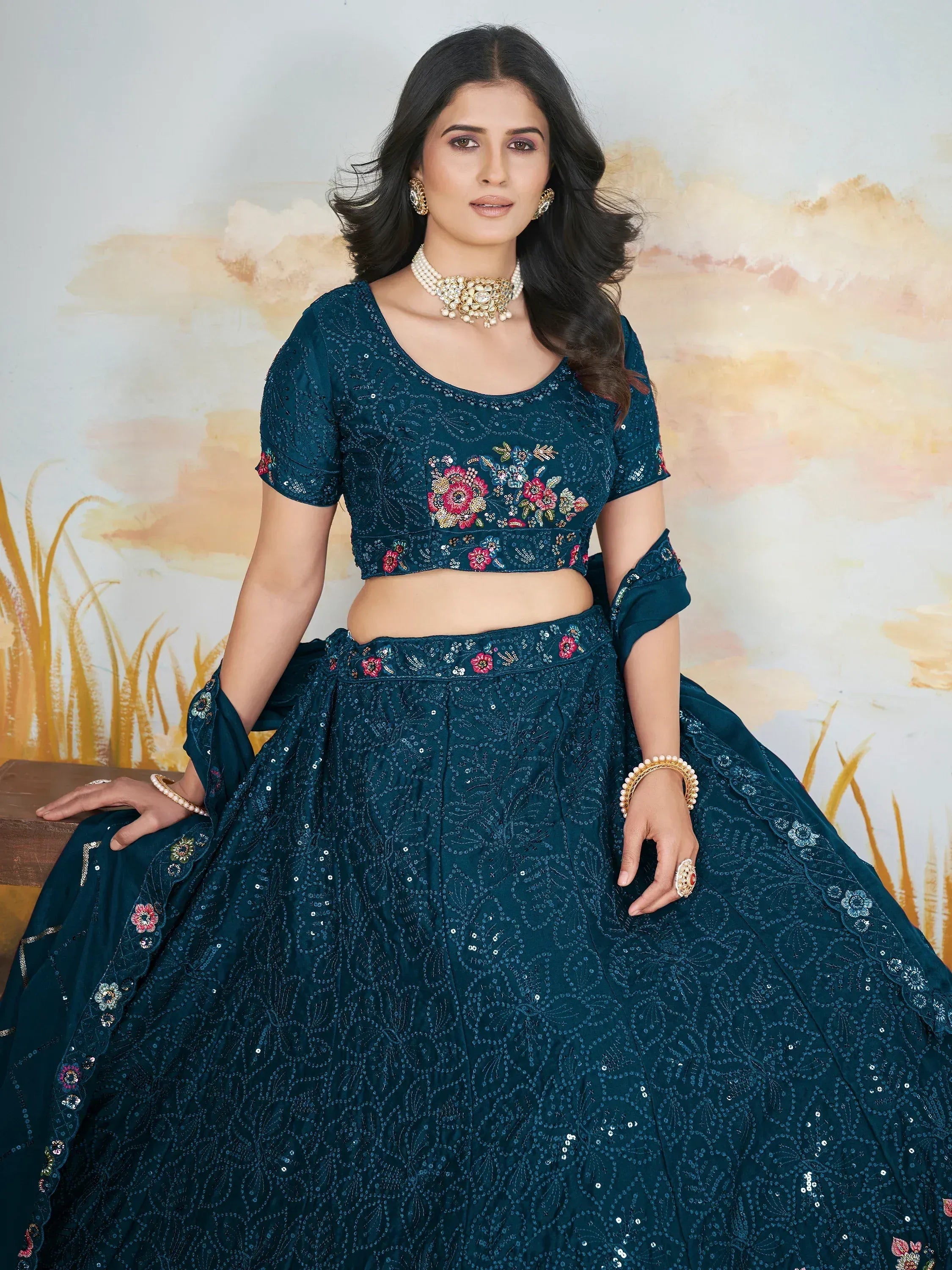 Teal designer lehenga choli with floral embroidery and sequins, perfect for Indian ethnic wear events