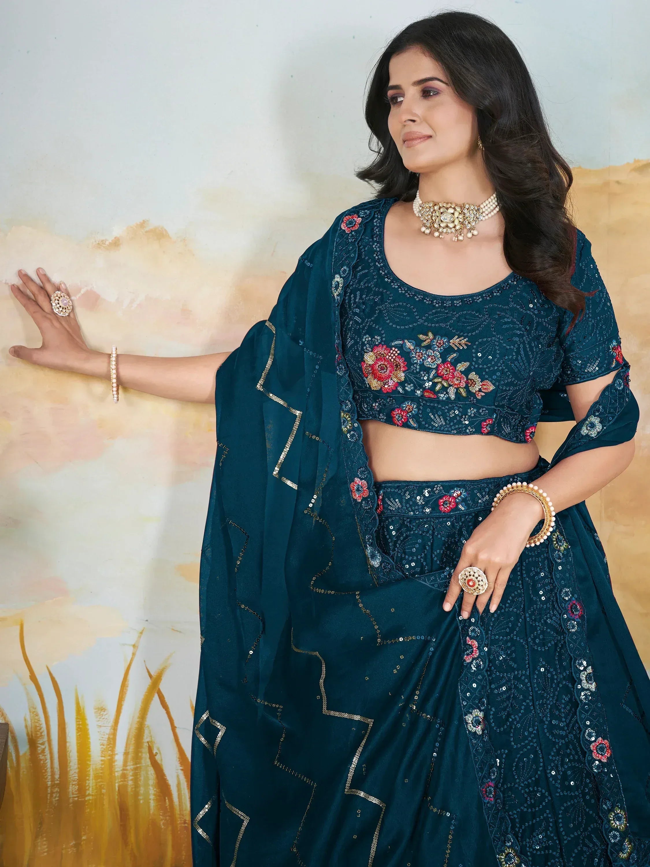 Teal floral embroidered lehenga choli with sequins, perfect for Indian ethnic wear and festive occasions.