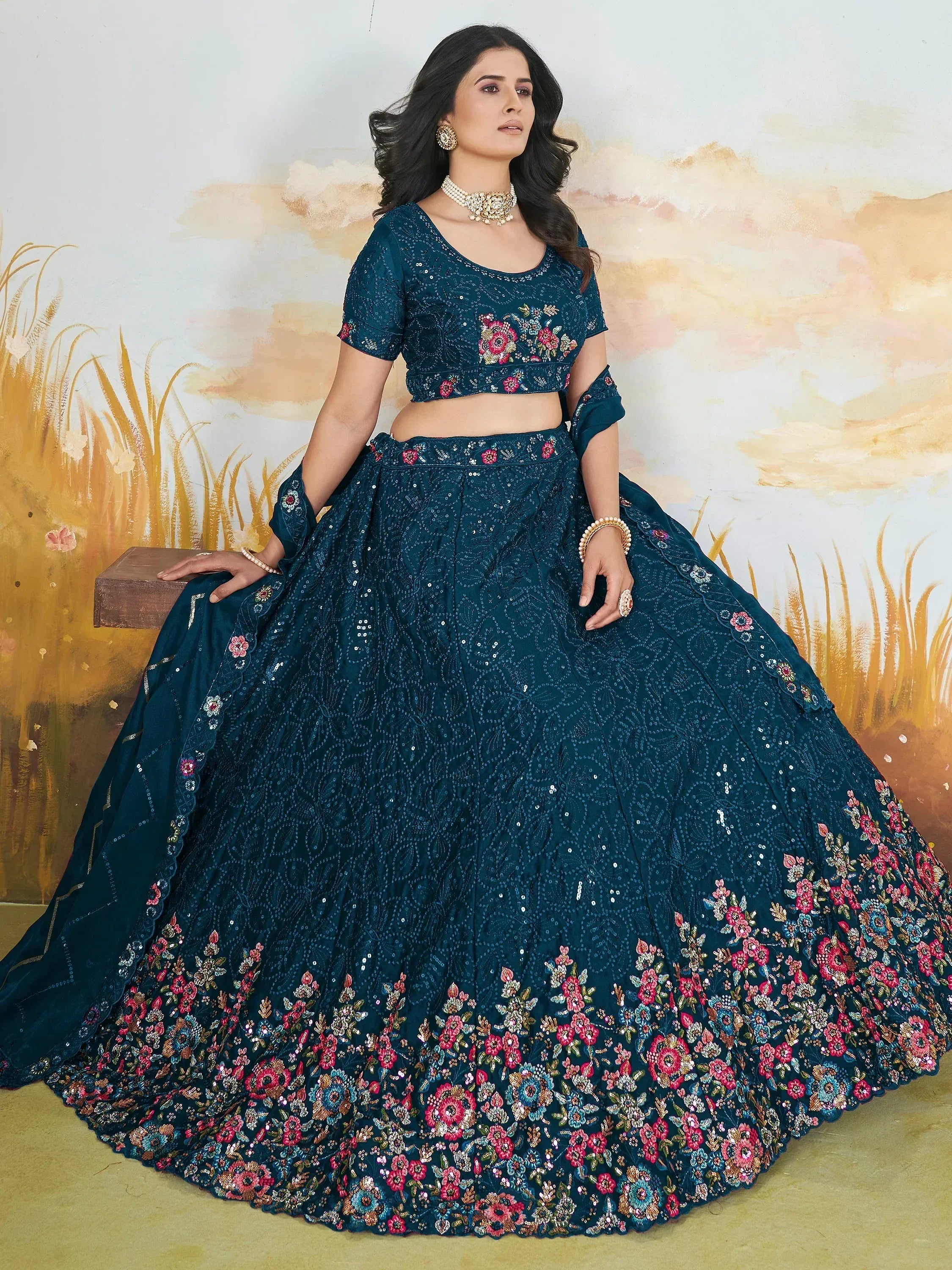 Teal floral embroidered lehenga choli with sequins, perfect for Indian weddings and festive occasions.