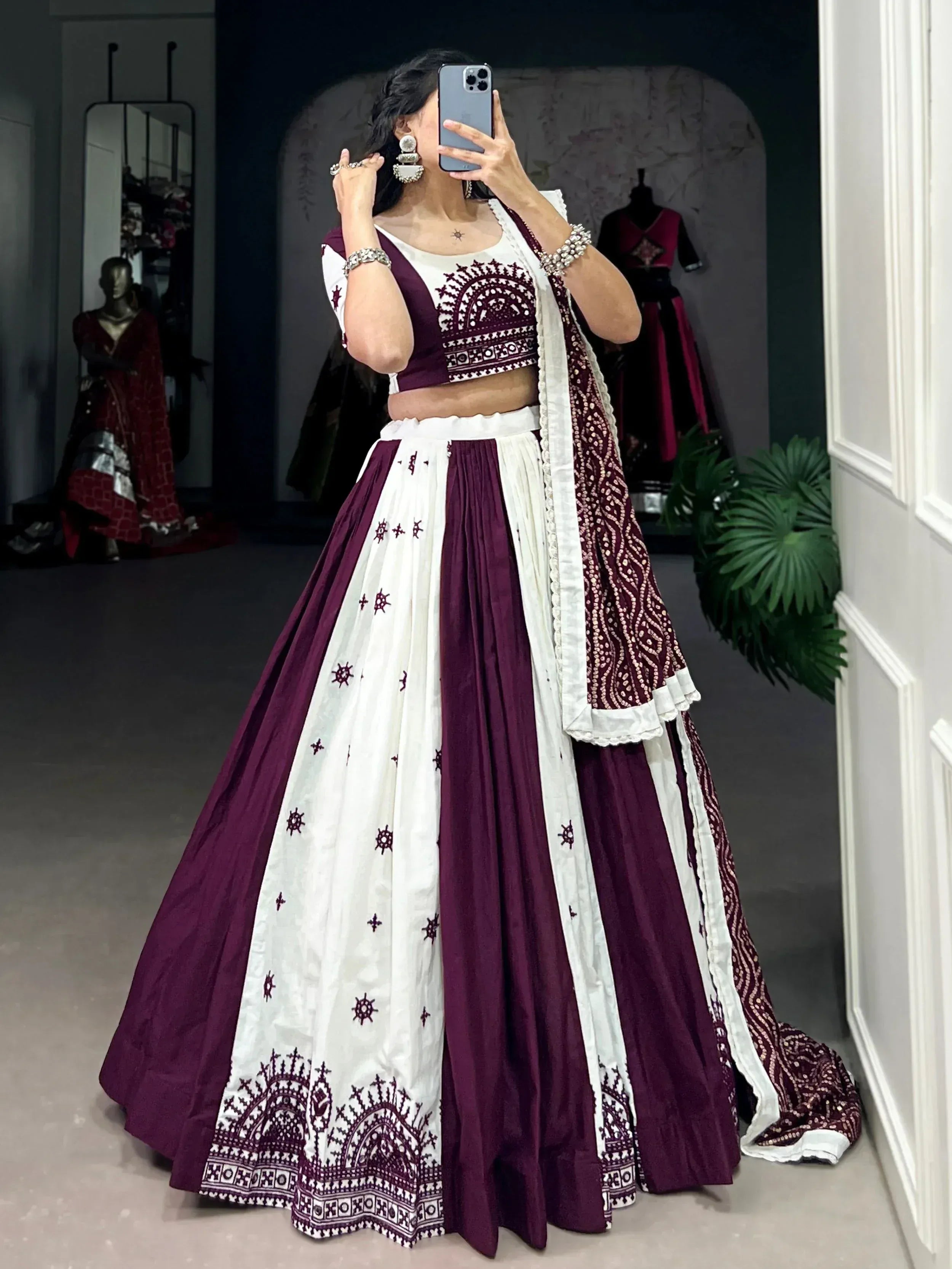 Maroon and white embroidered lehenga choli with mirror work, perfect for Indian ethnic wear events