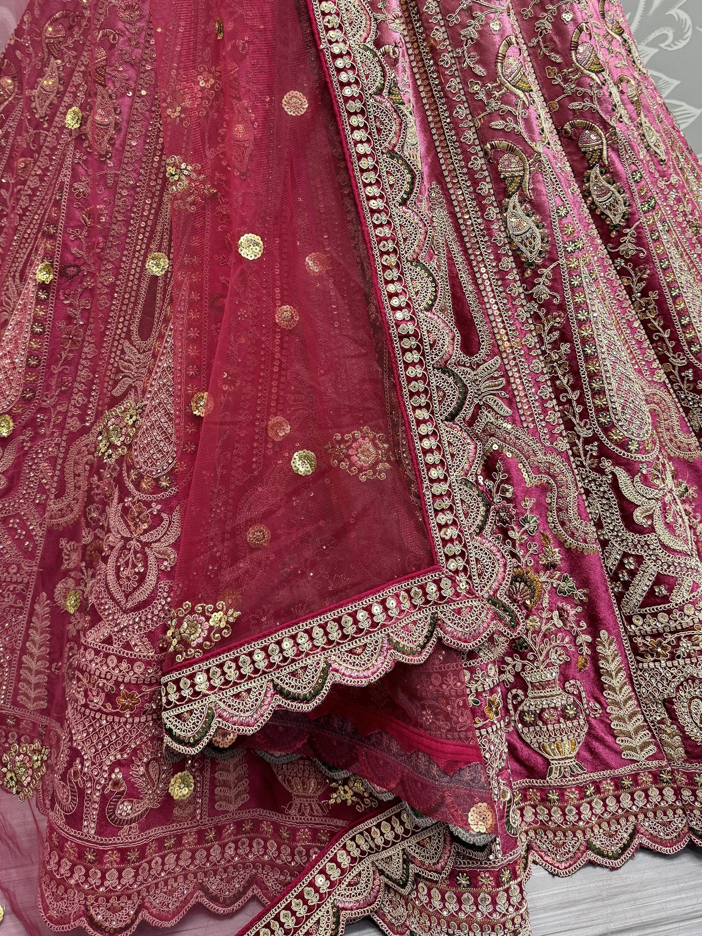 Luxury maroon lehenga choli with intricate gold embroidery and sequin detailing for Indian ethnic wear