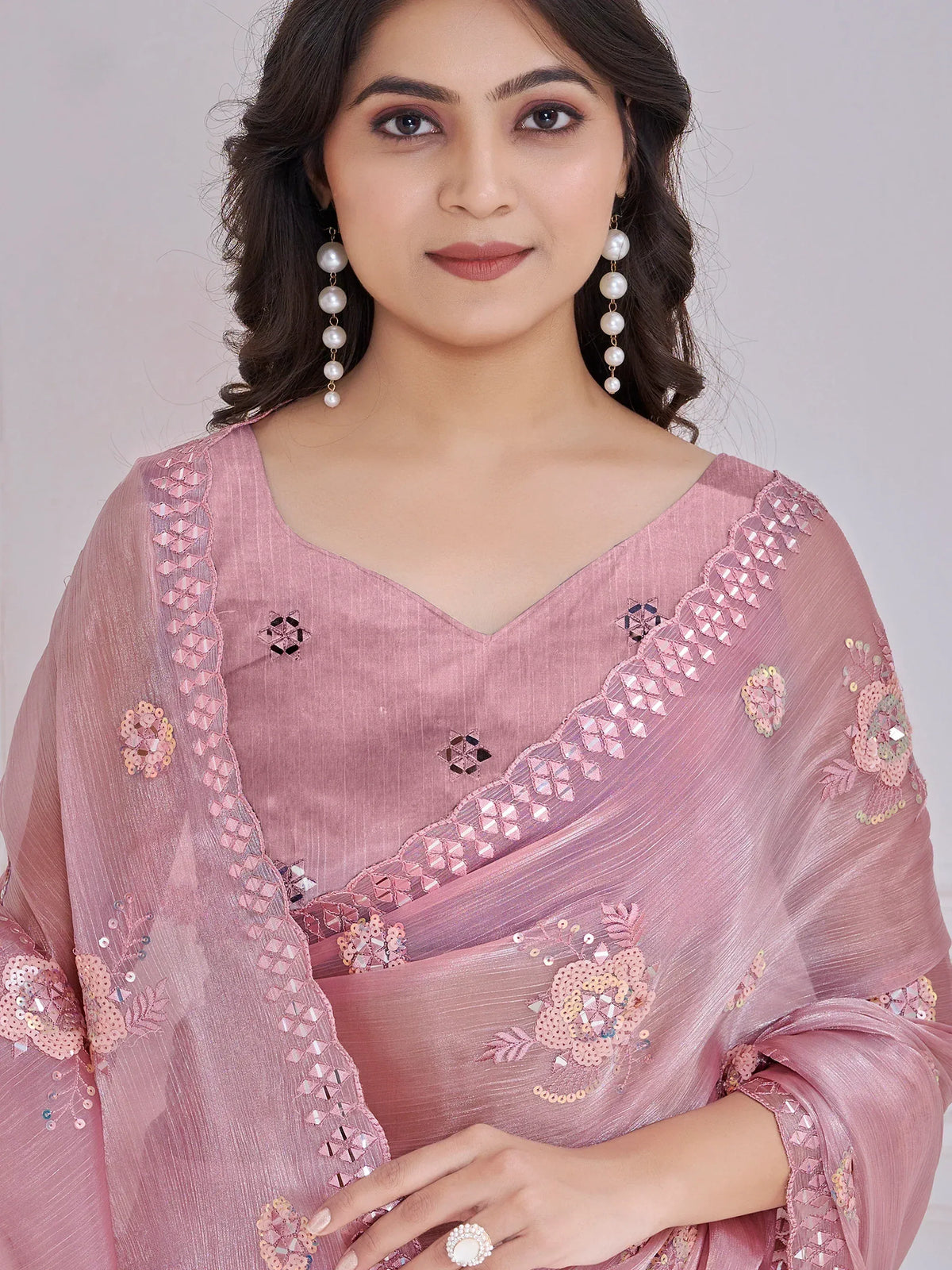 Pink embroidered saree with sequin floral details, perfect for Indian ethnic wear occasions