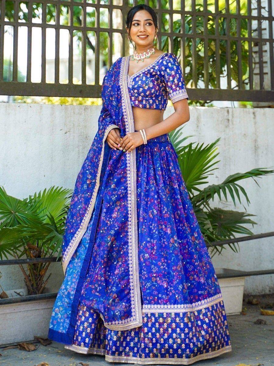 Blue floral lehenga choli with gold border, perfect for Indian ethnic occasions