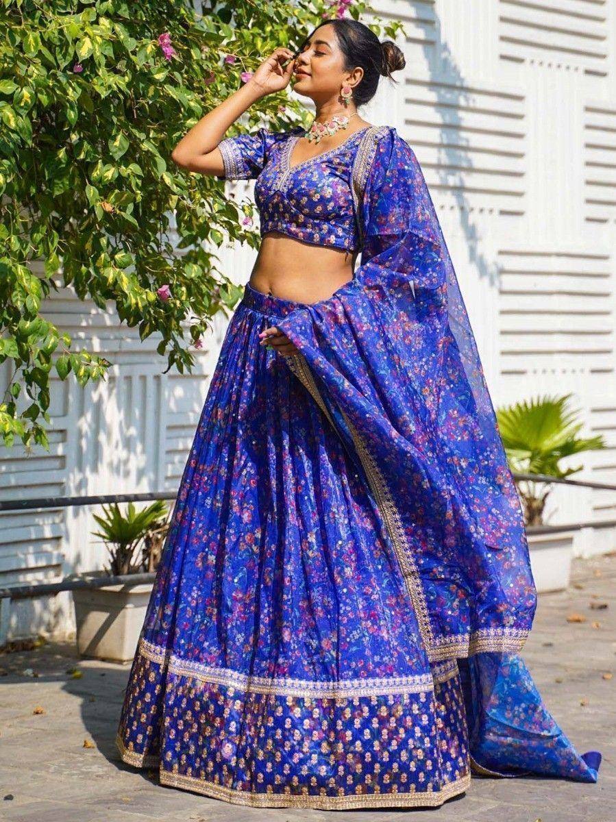 Blue floral lehenga choli with gold border, perfect for Indian ethnic wear and festive occasions