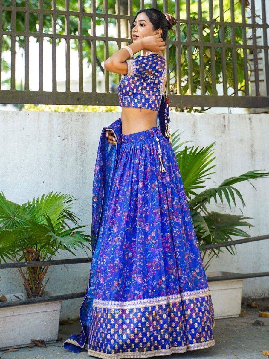 Blue floral lehenga choli with gold border, perfect for Indian ethnic wear occasions