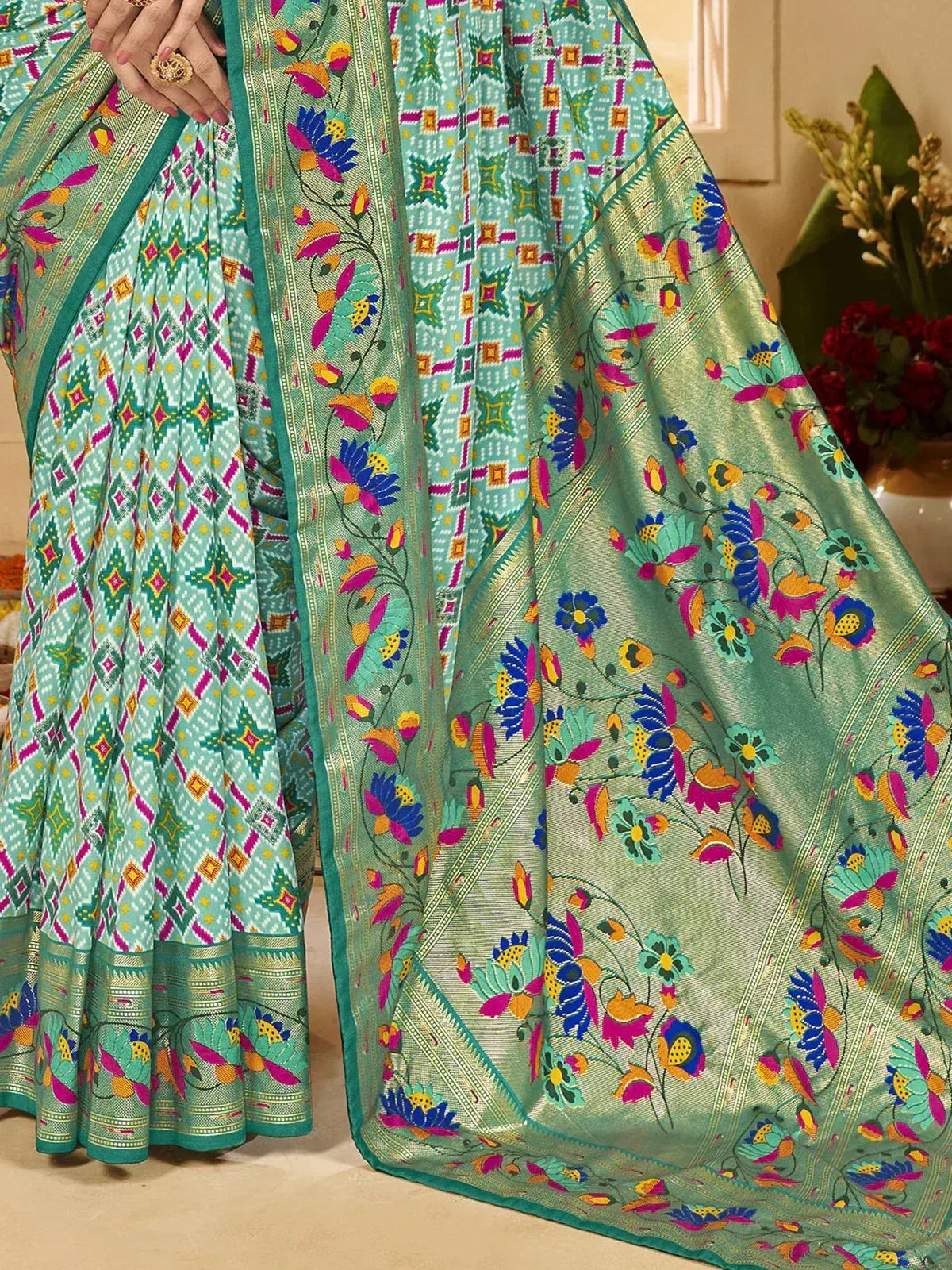 Vibrant green saree with floral and geometric prints, perfect for ethnic occasions