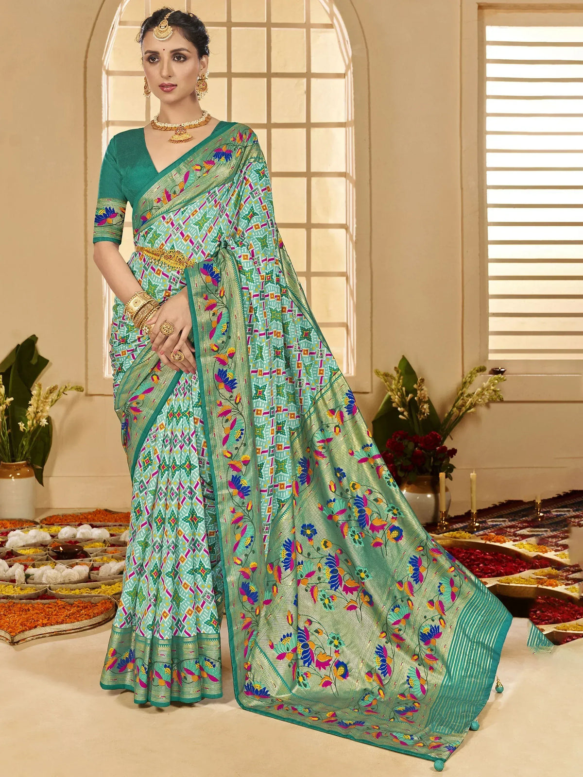 Woman in vibrant green printed saree with floral and geometric patterns, traditional Indian ethnic wear