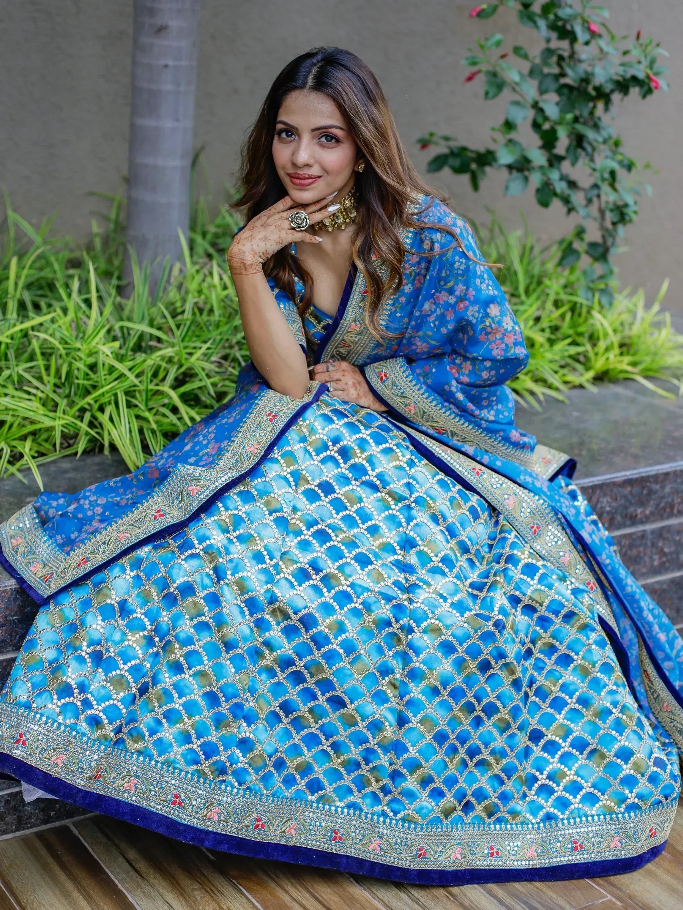 Blue floral lehenga choli with intricate embroidery and mirror work, perfect for Indian ethnic occasions