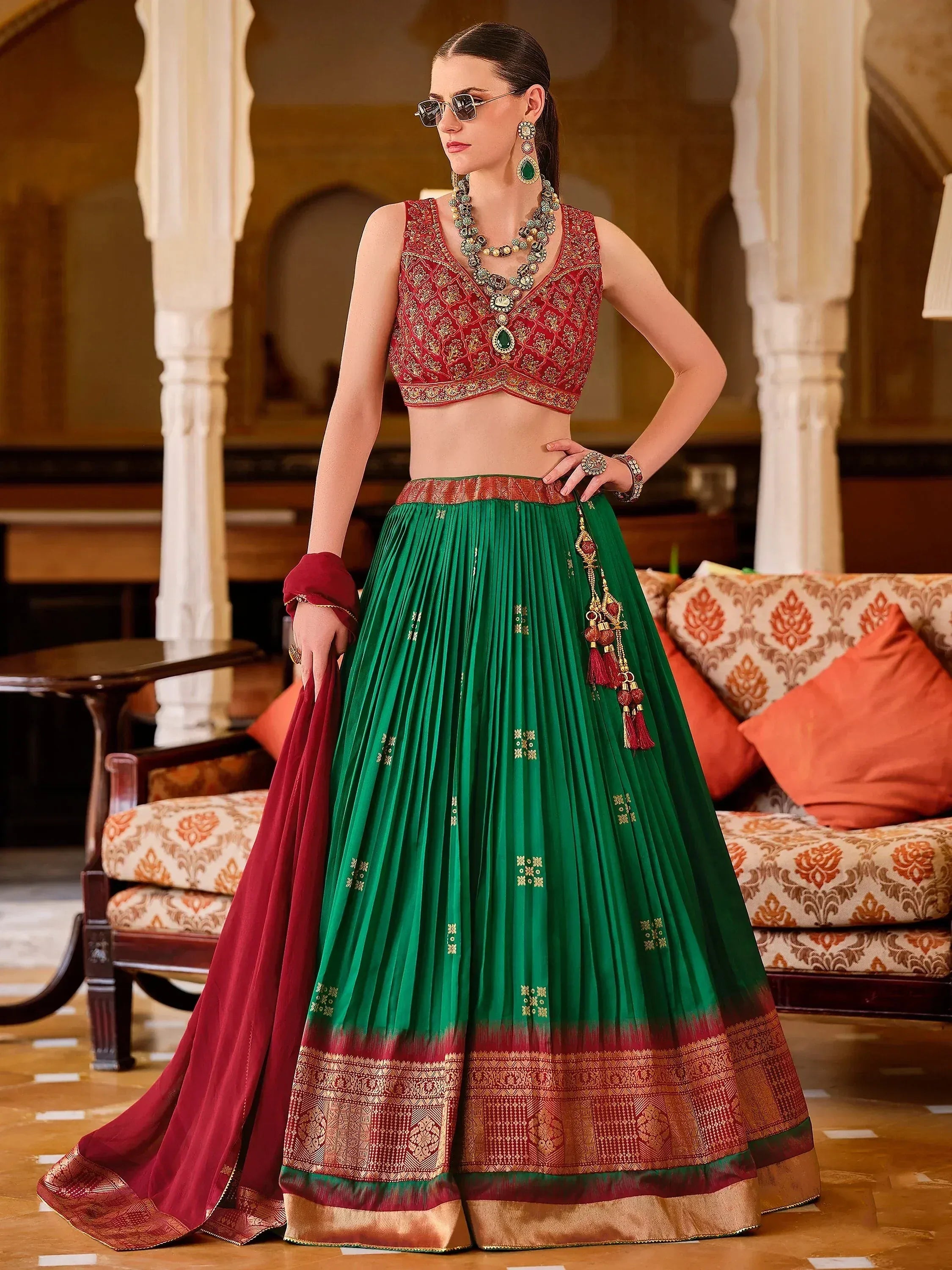 Green and red designer lehenga choli with gold embroidery, perfect for Indian ethnic wear occasions