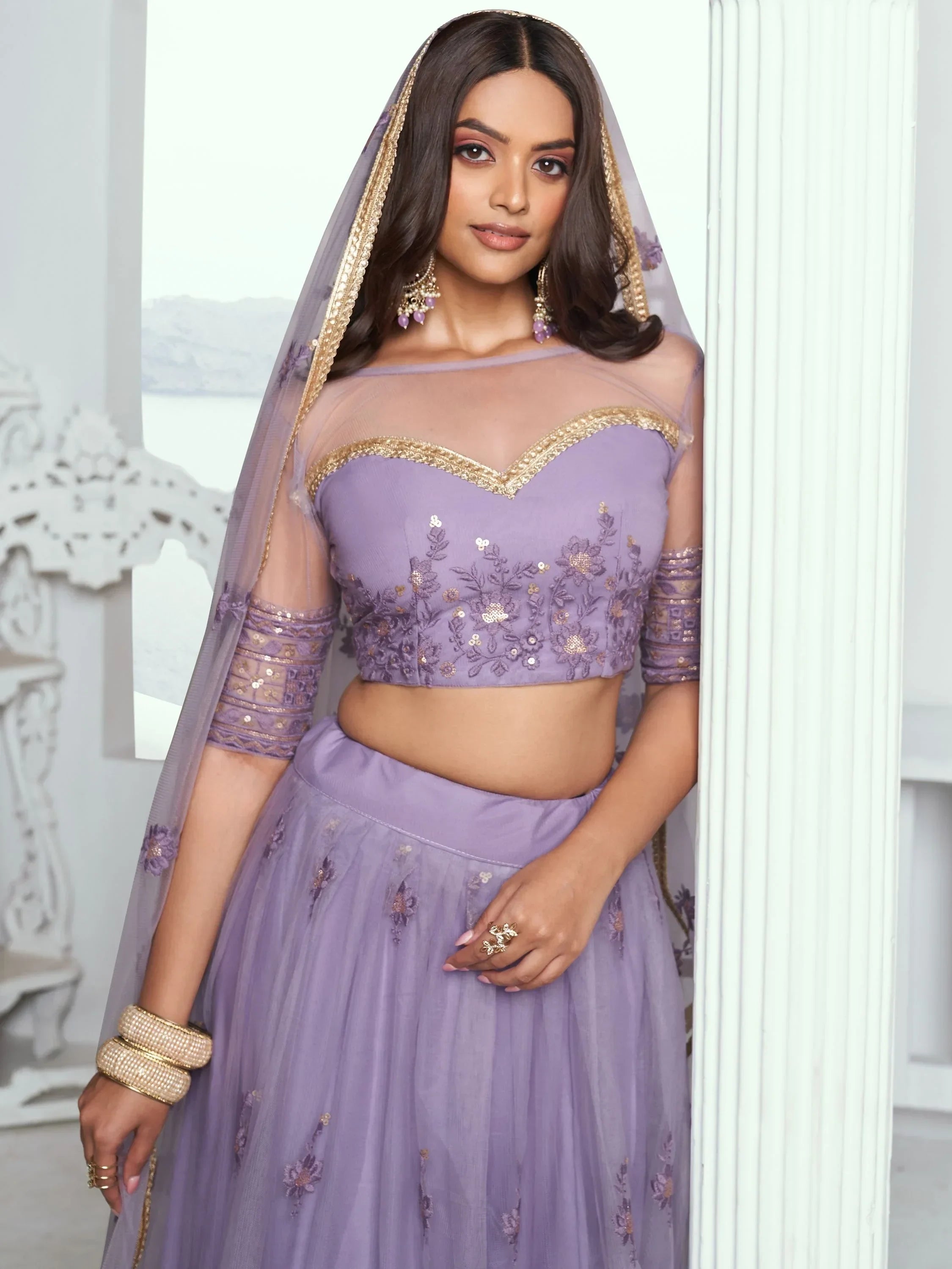 Lavender designer lehenga choli with gold embroidery and sheer dupatta, perfect for Indian ethnic wear