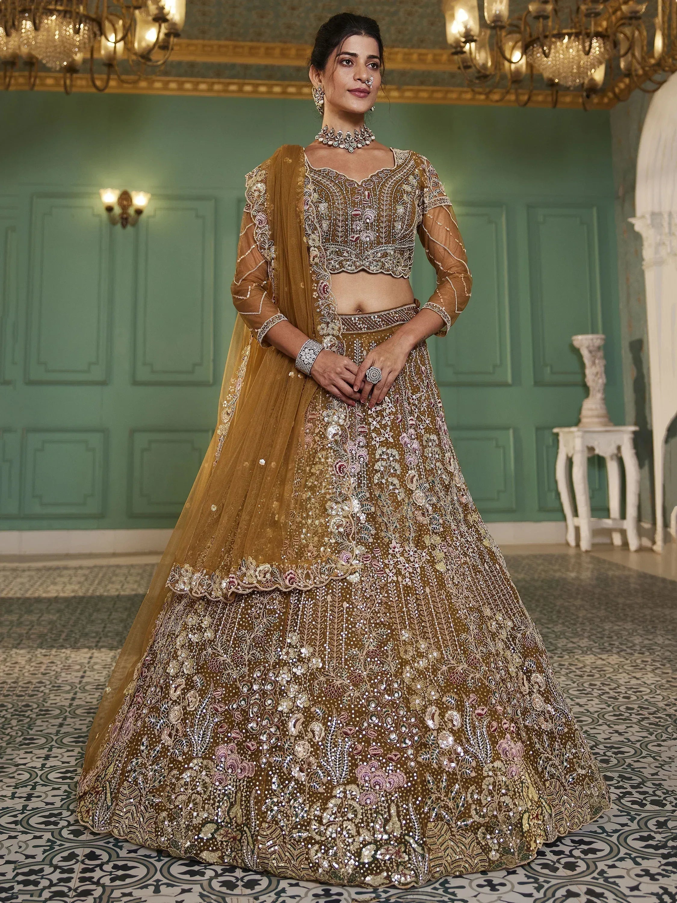 Elegant mustard lehenga choli with intricate floral embroidery and sequins, perfect for Indian weddings and festive occasions.