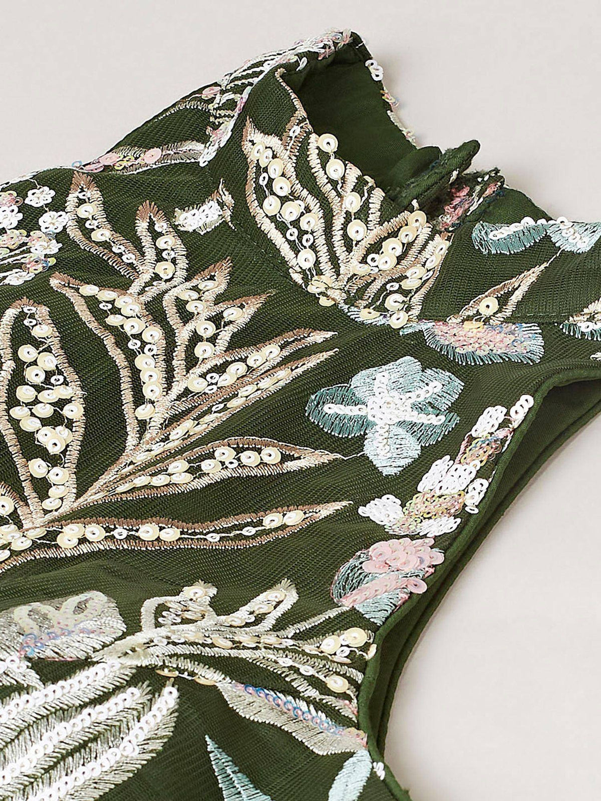 Emerald green ethnic gown with floral sequin embroidery, perfect for Indian weddings and festive occasions.